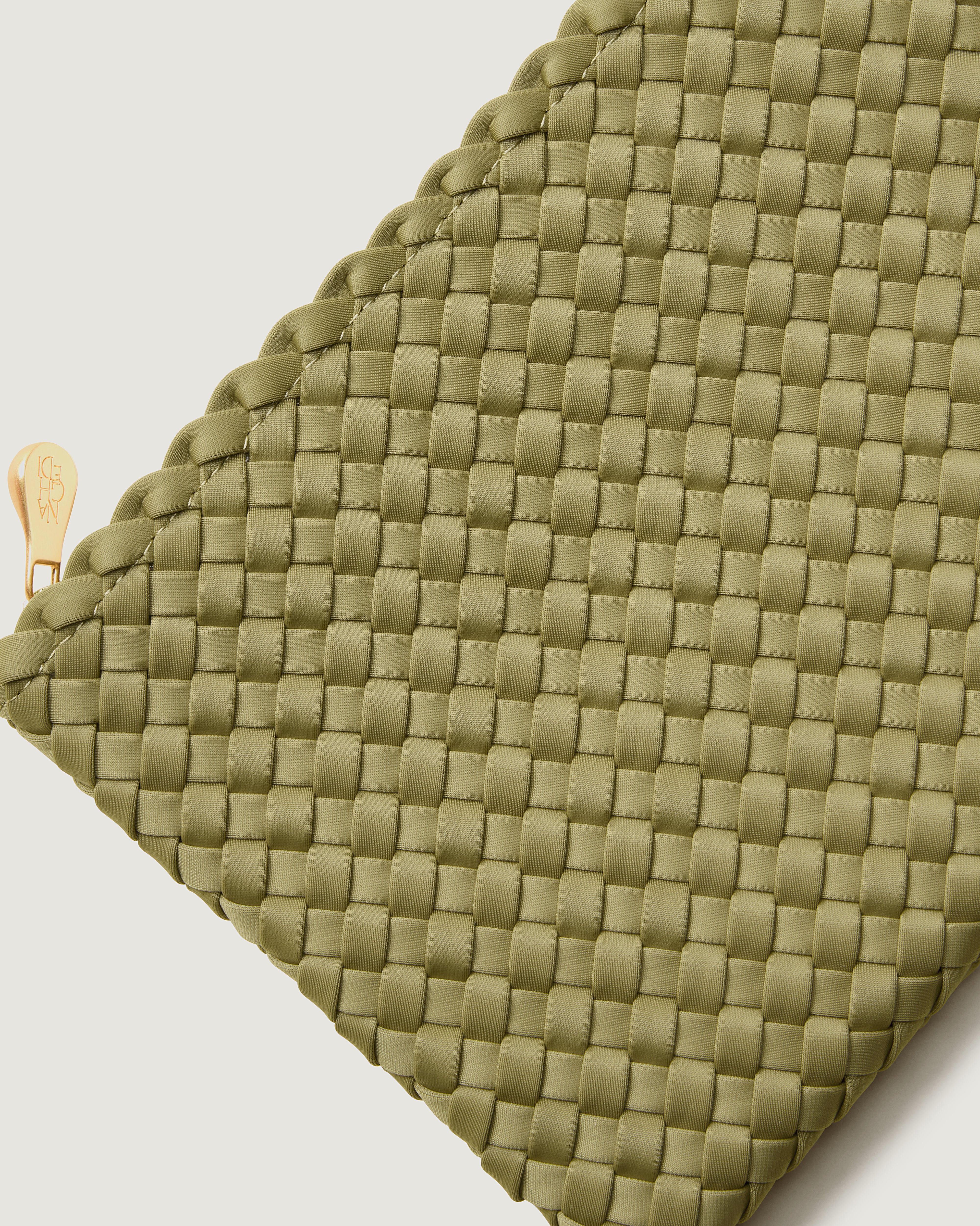 Close-up of included matching woven zippered pouch.