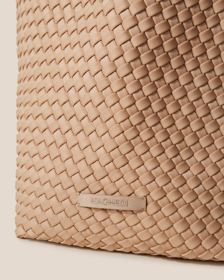 Close-up of stamped NAGHEDI logo on St. Barths Tote in Camel.