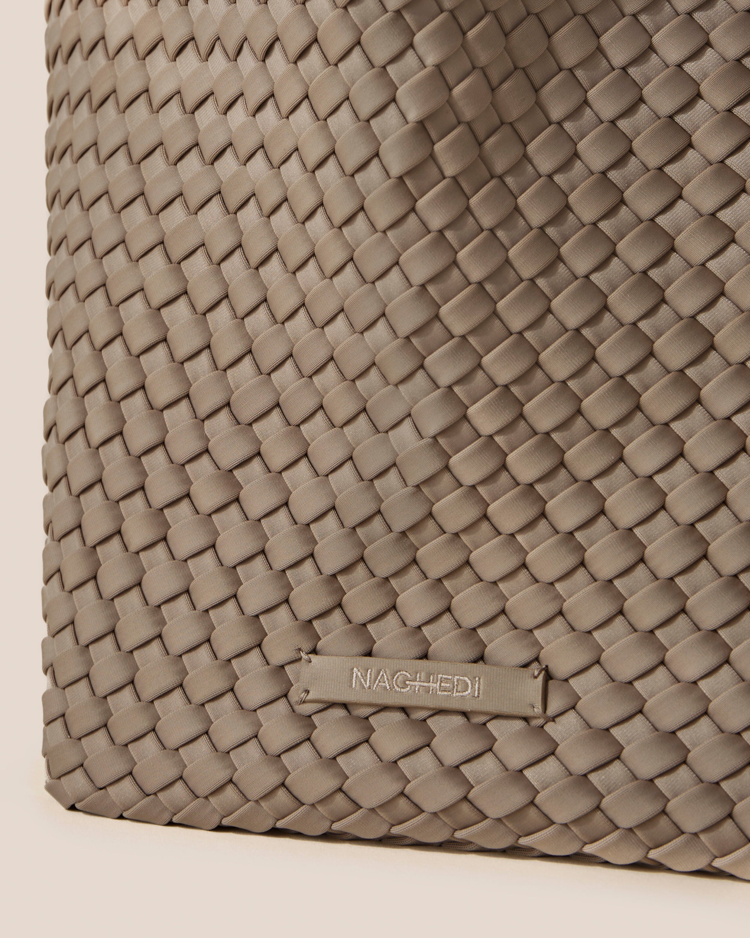 Close-up of stamped NAGHEDI logo on St. Barths Tote in Cashmere.
