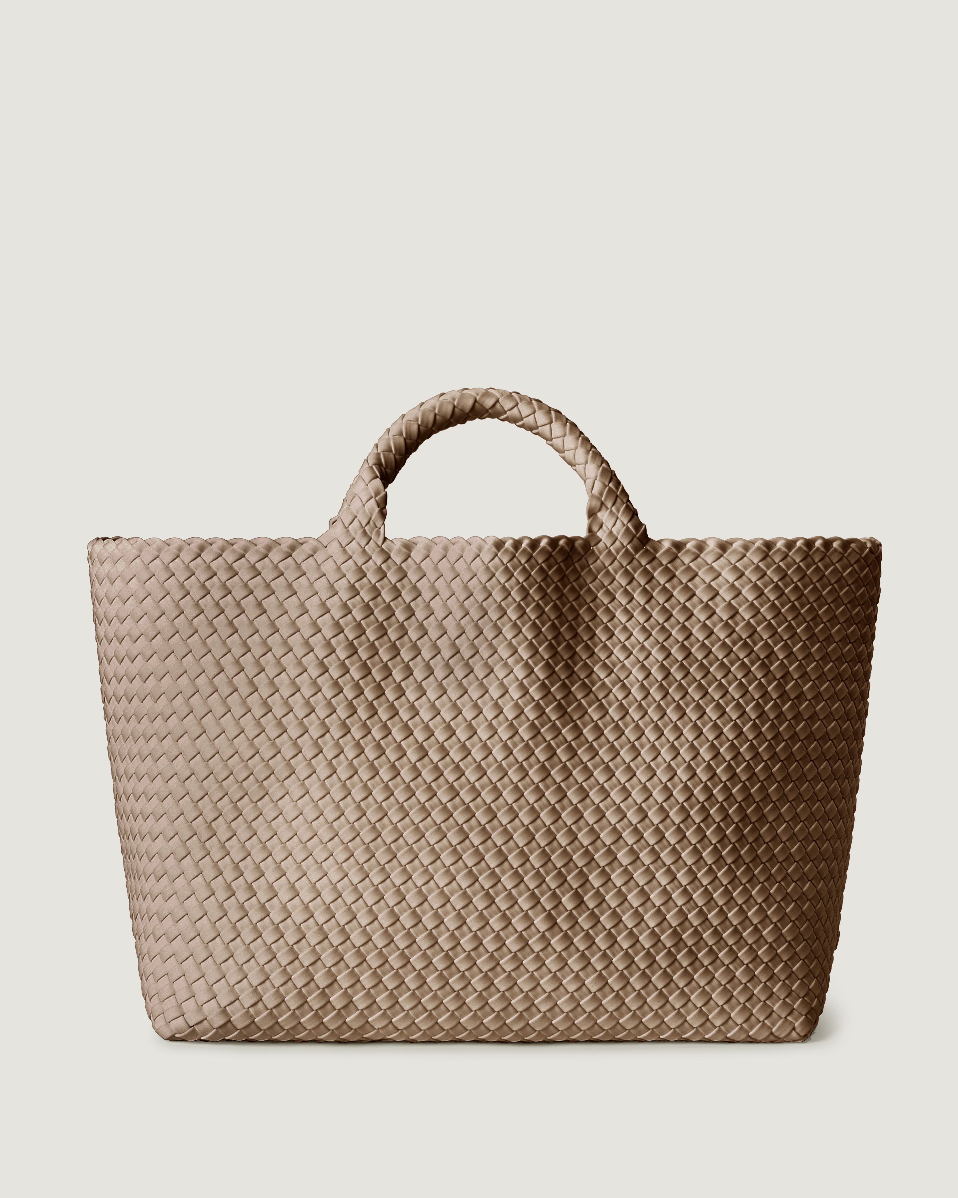 St. Barths Tote in Cashmere, a taupe tone, in handwoven neoprene, featuring an open top, and woven top handles.