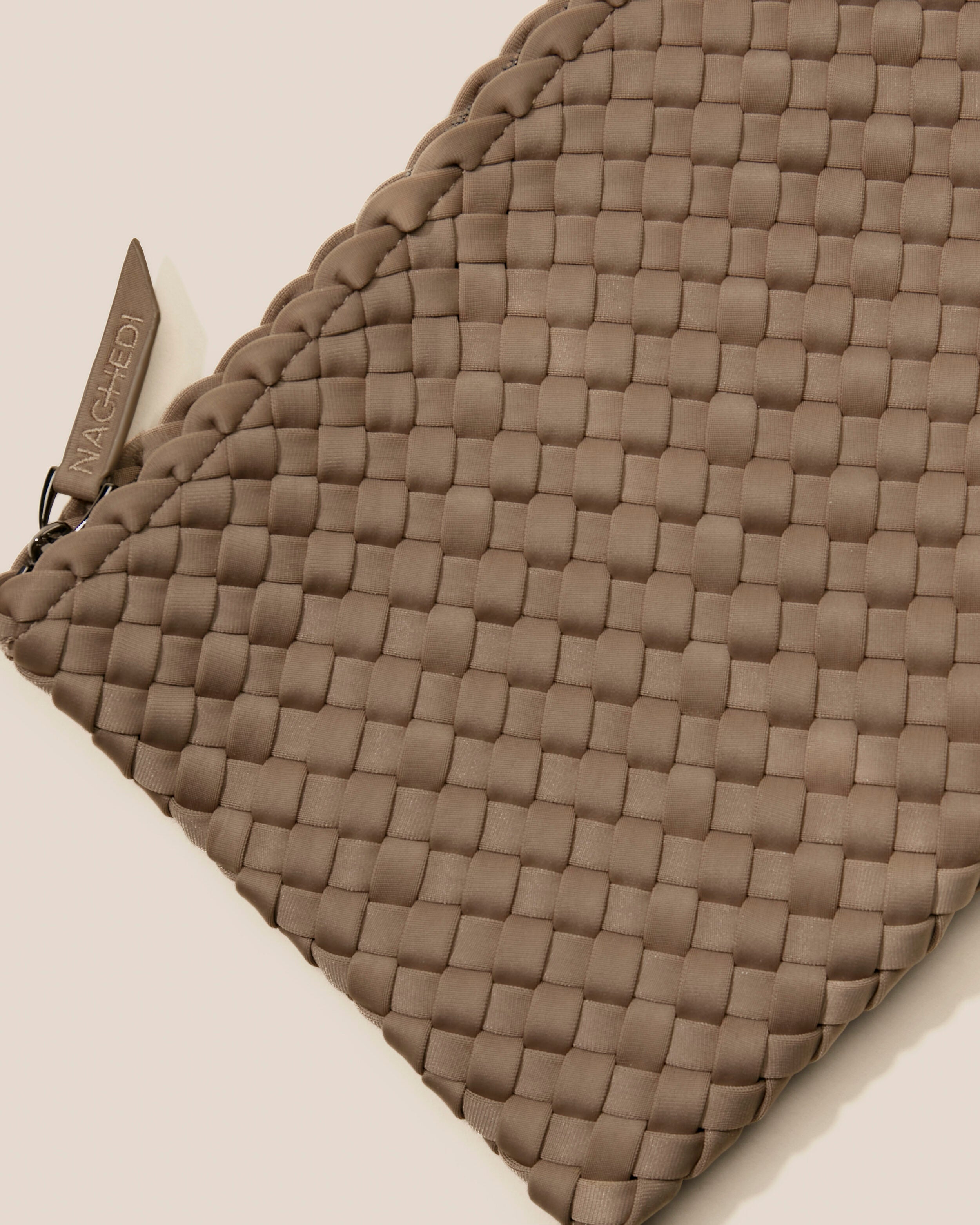 Close-up of included matching woven zippered pouch.