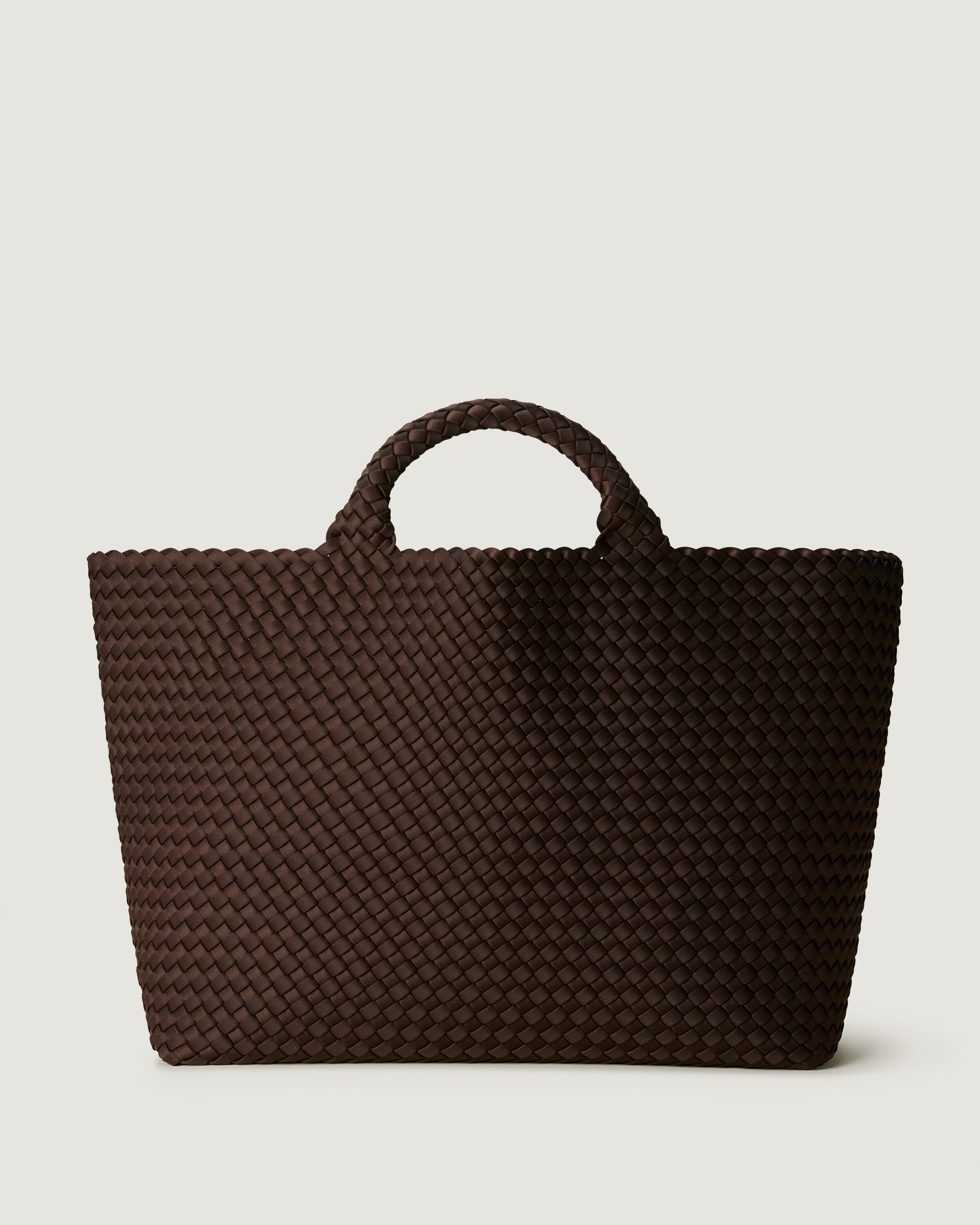 St. Barths Tote in Chocolate, a dark chocolate brown tone, in handwoven neoprene, featuring an open top, and woven top handles.