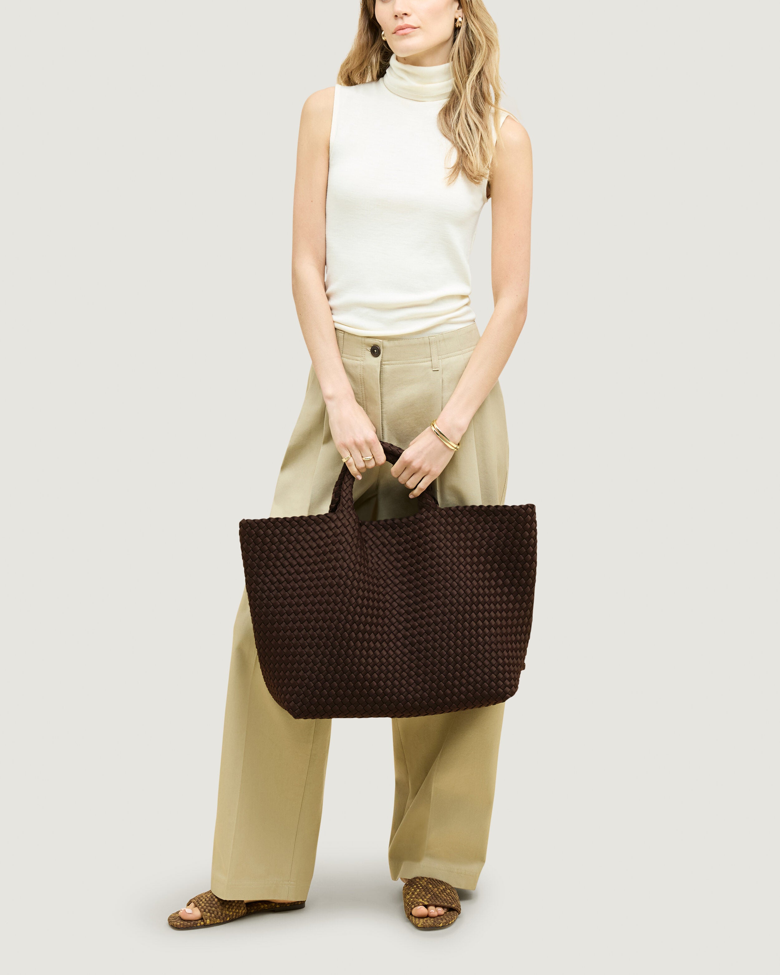 St. Barths Tote in Chocolate shown on model to illustrate scale and soft silhouette.