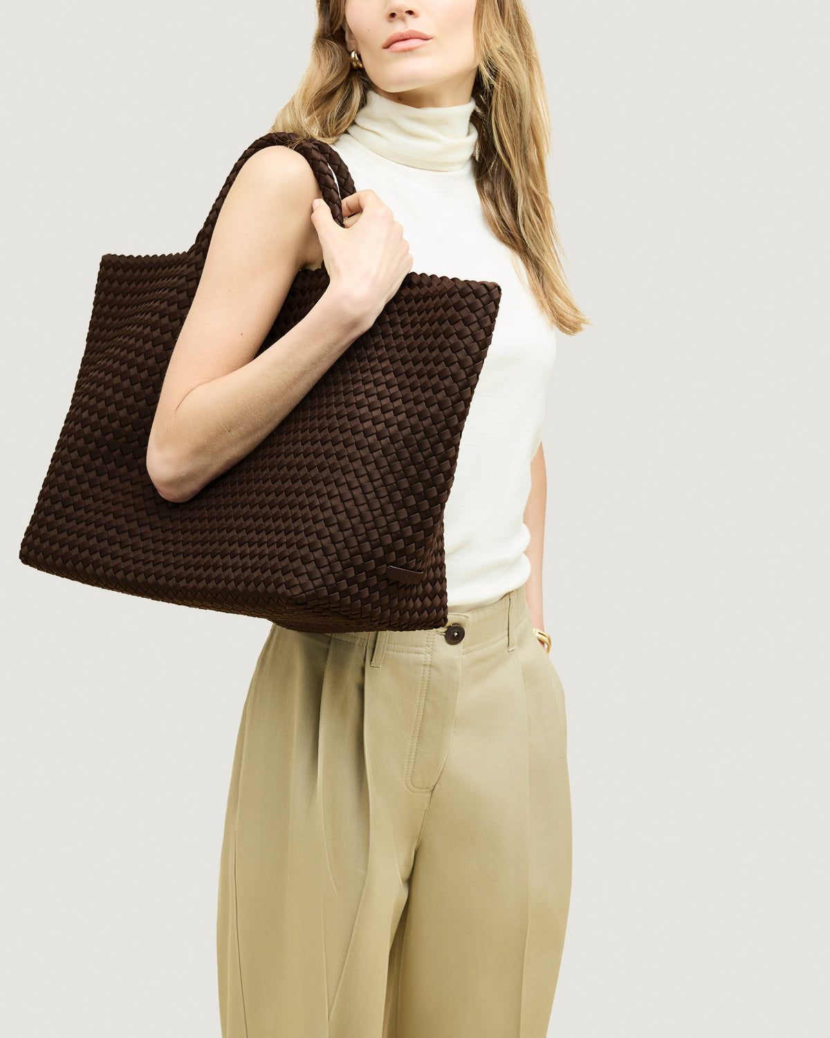 St. Barths Tote in Chocolate shown on model to illustrate scale and soft silhouette.
