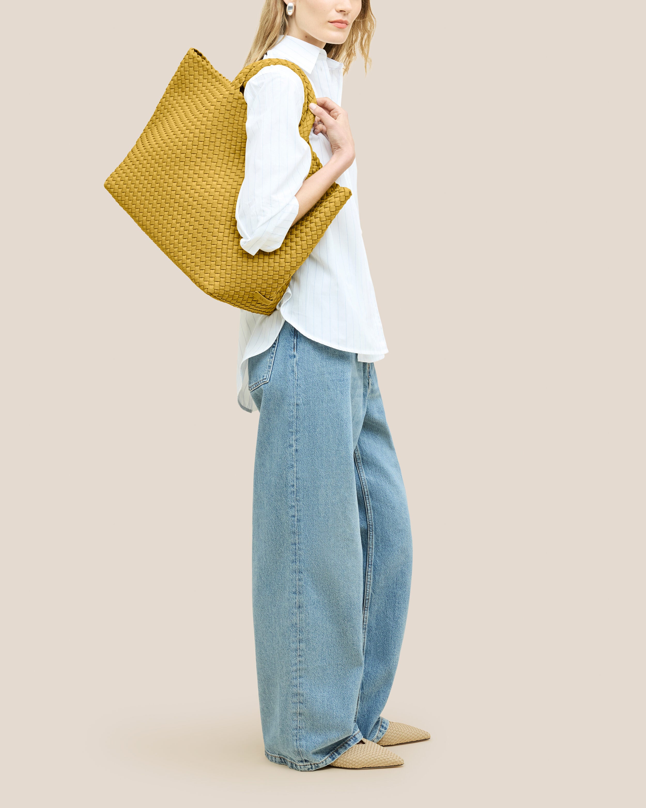 St. Barths Tote in Citrine shown on model to illustrate scale and soft silhouette.