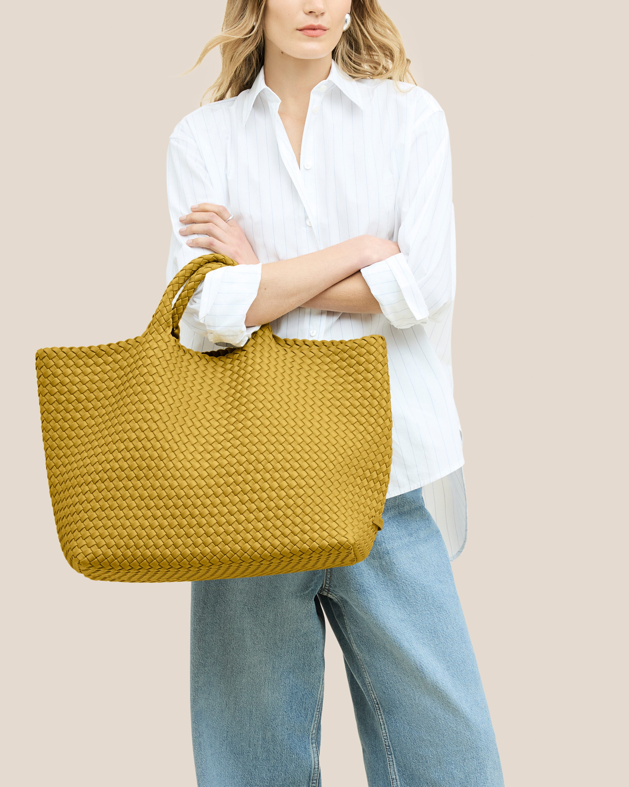 St. Barths Tote in Citrine shown on model to illustrate scale and soft silhouette.