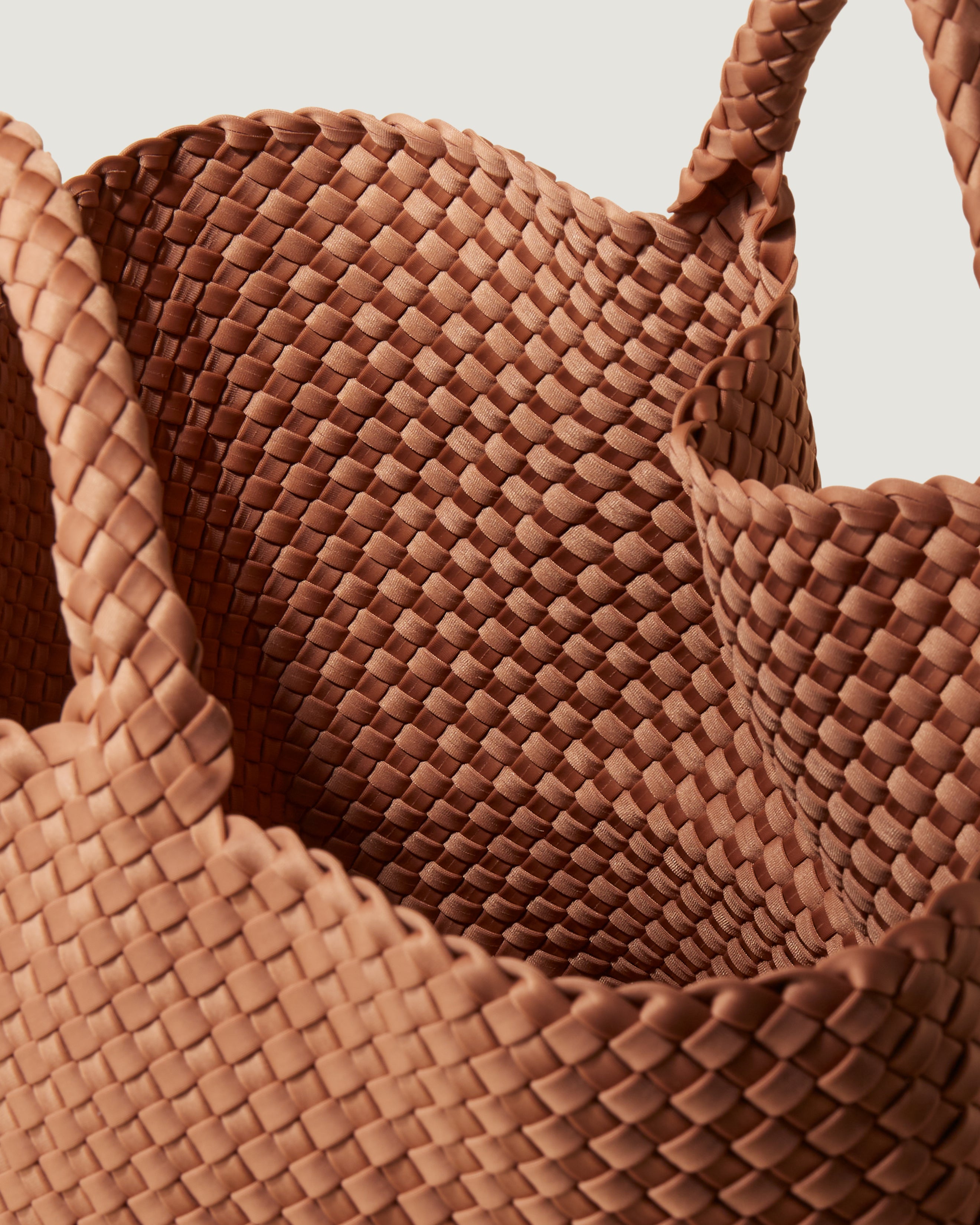 Interior close-up of St. Barths Tote in Cocoa showing its open top, and unlined interior.