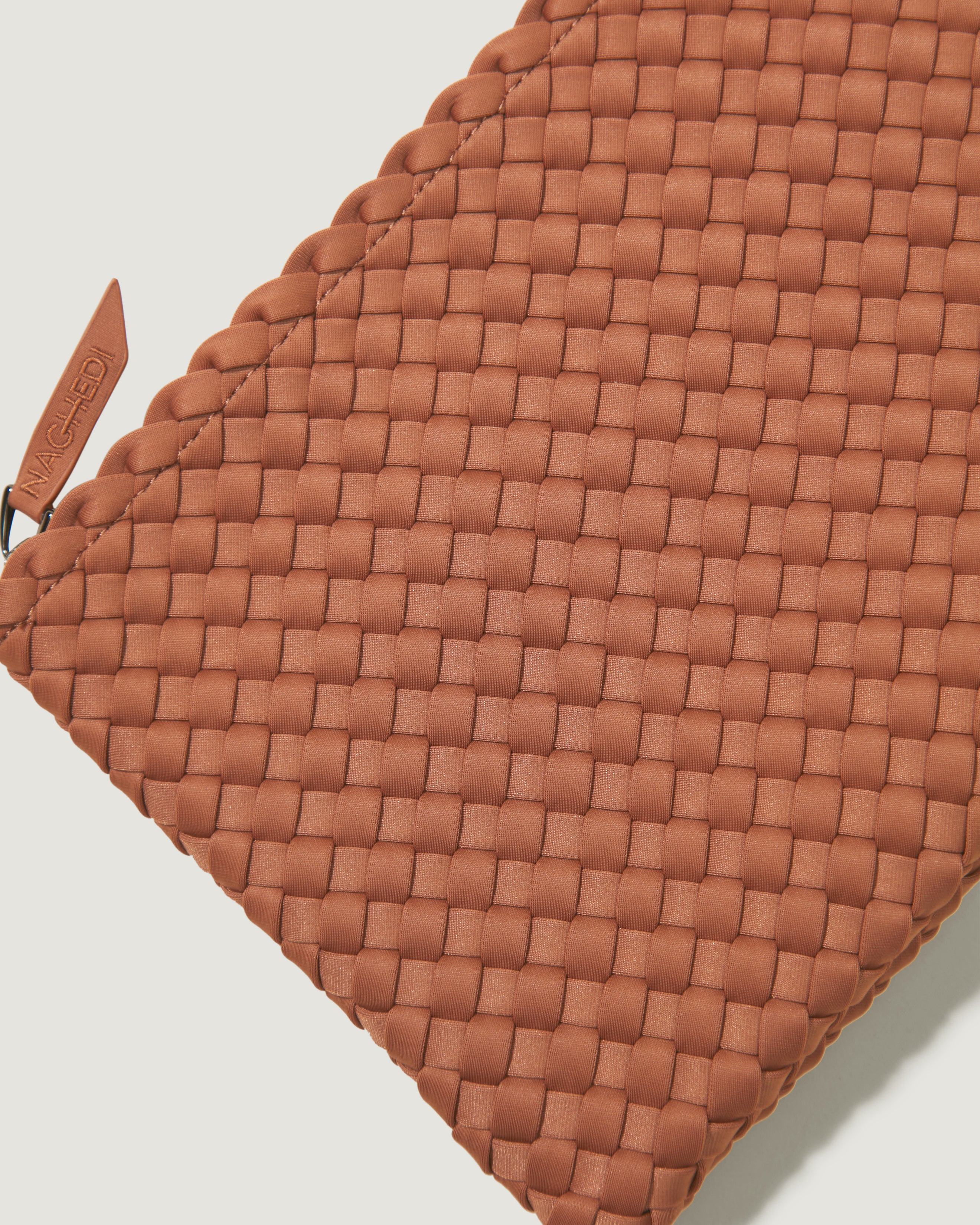Close-up of included matching woven zippered pouch.