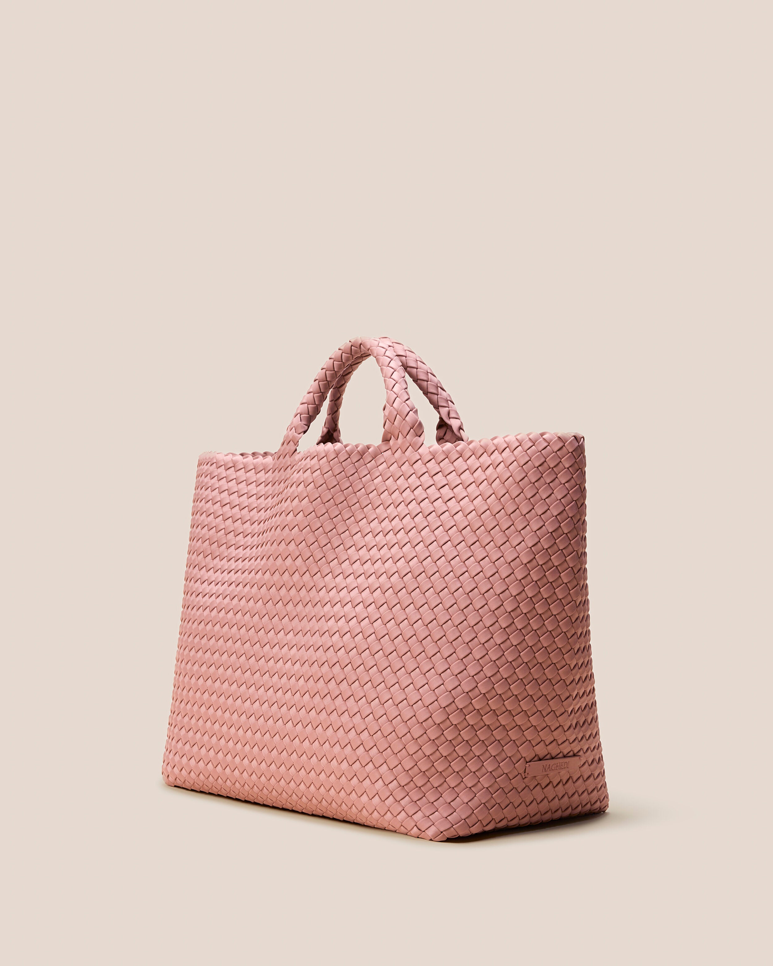 St. Barths Tote in Dusk shown from a side angle, highlighting its handwoven neoprene construction and open top.