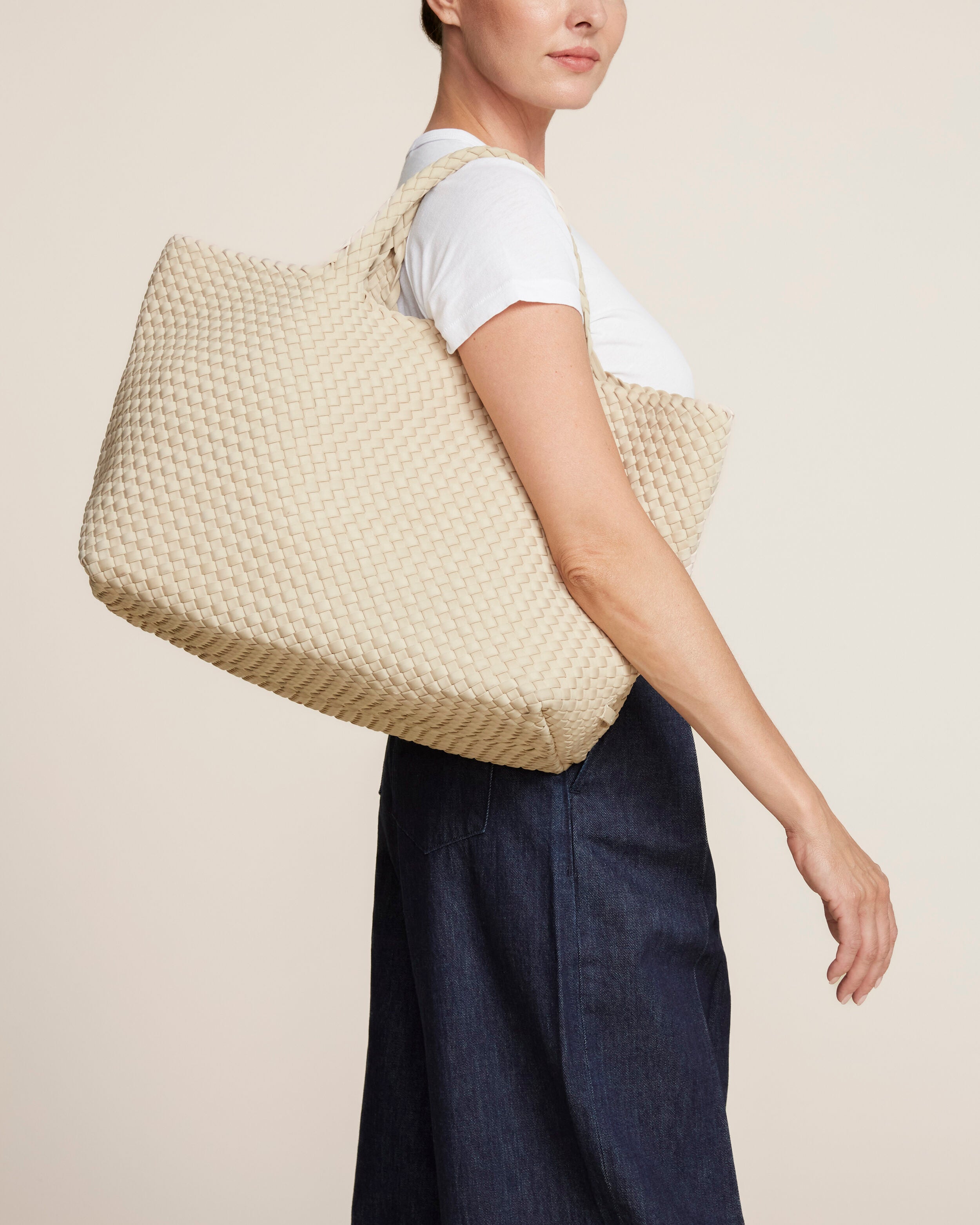 St. Barths Tote in Ecru shown on model to illustrate scale and soft silhouette.