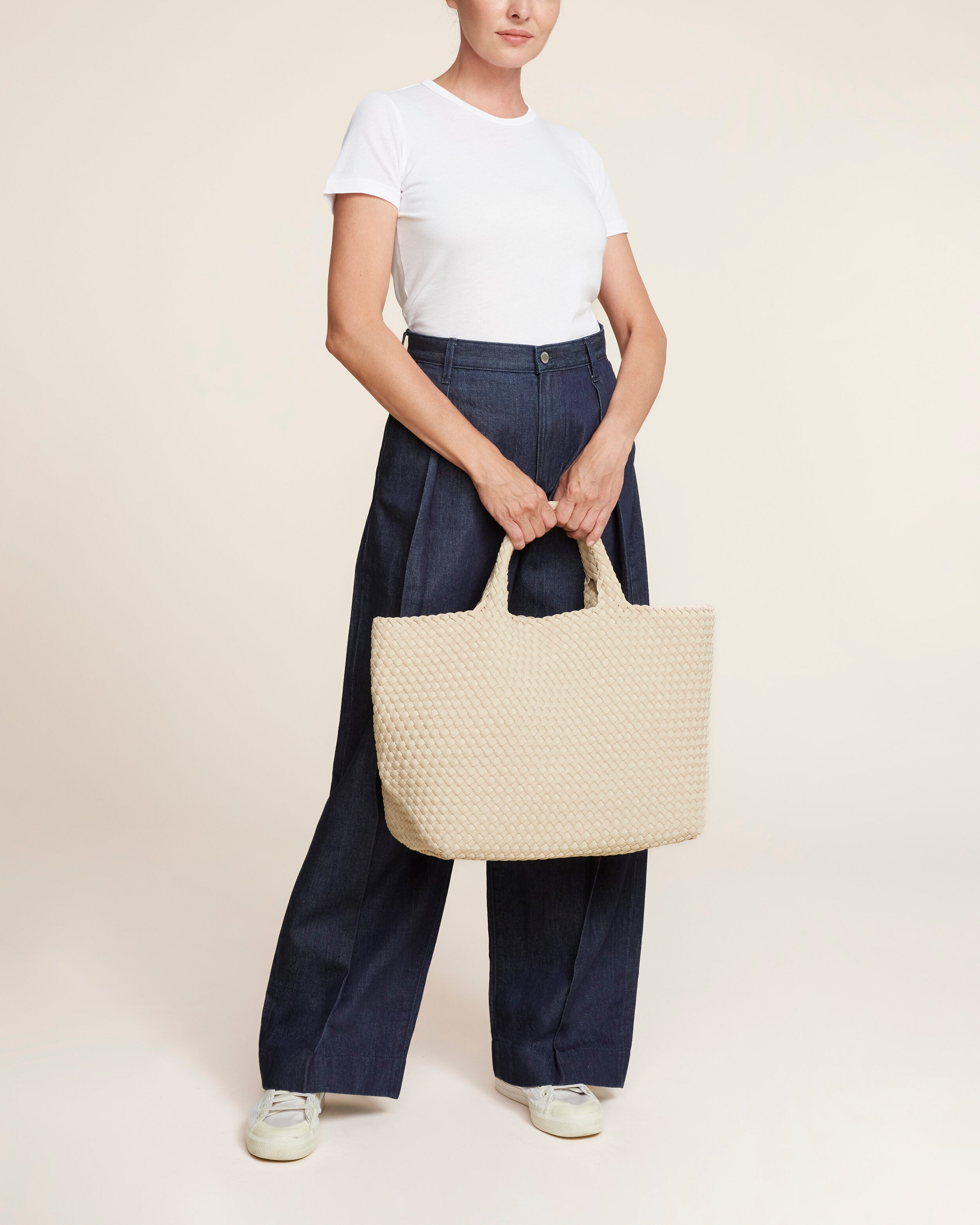 St. Barths Tote in Ecru shown on model to illustrate scale and soft silhouette.