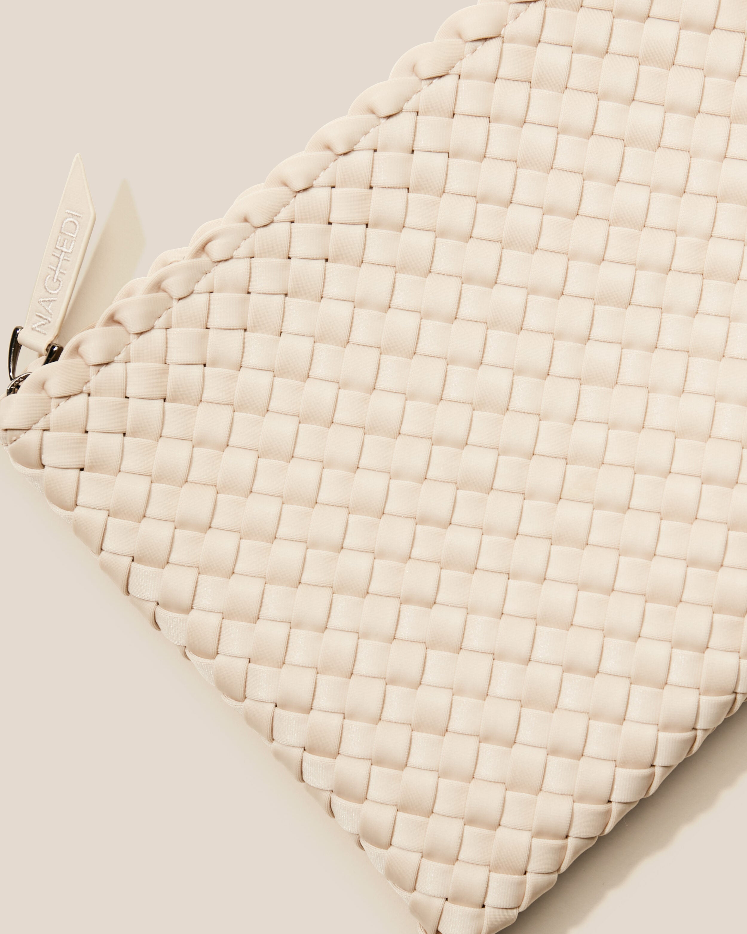 Close-up of included matching woven zippered pouch.