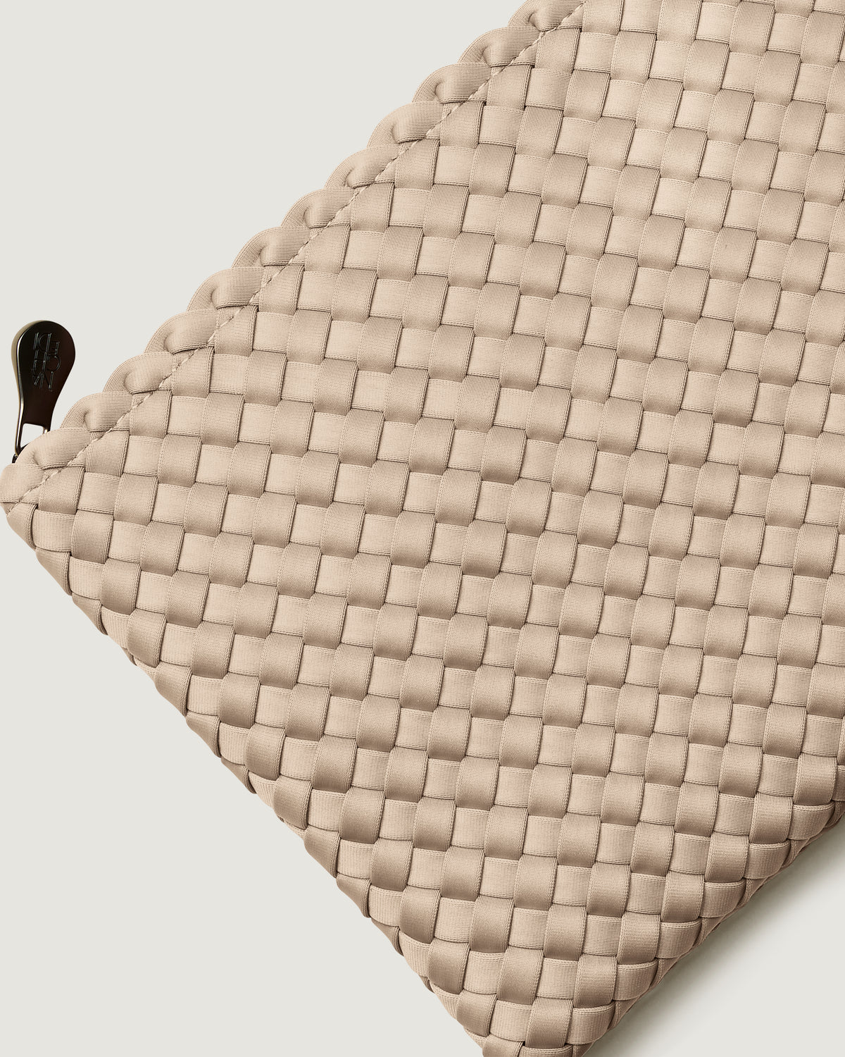Close-up of included matching woven zippered pouch.