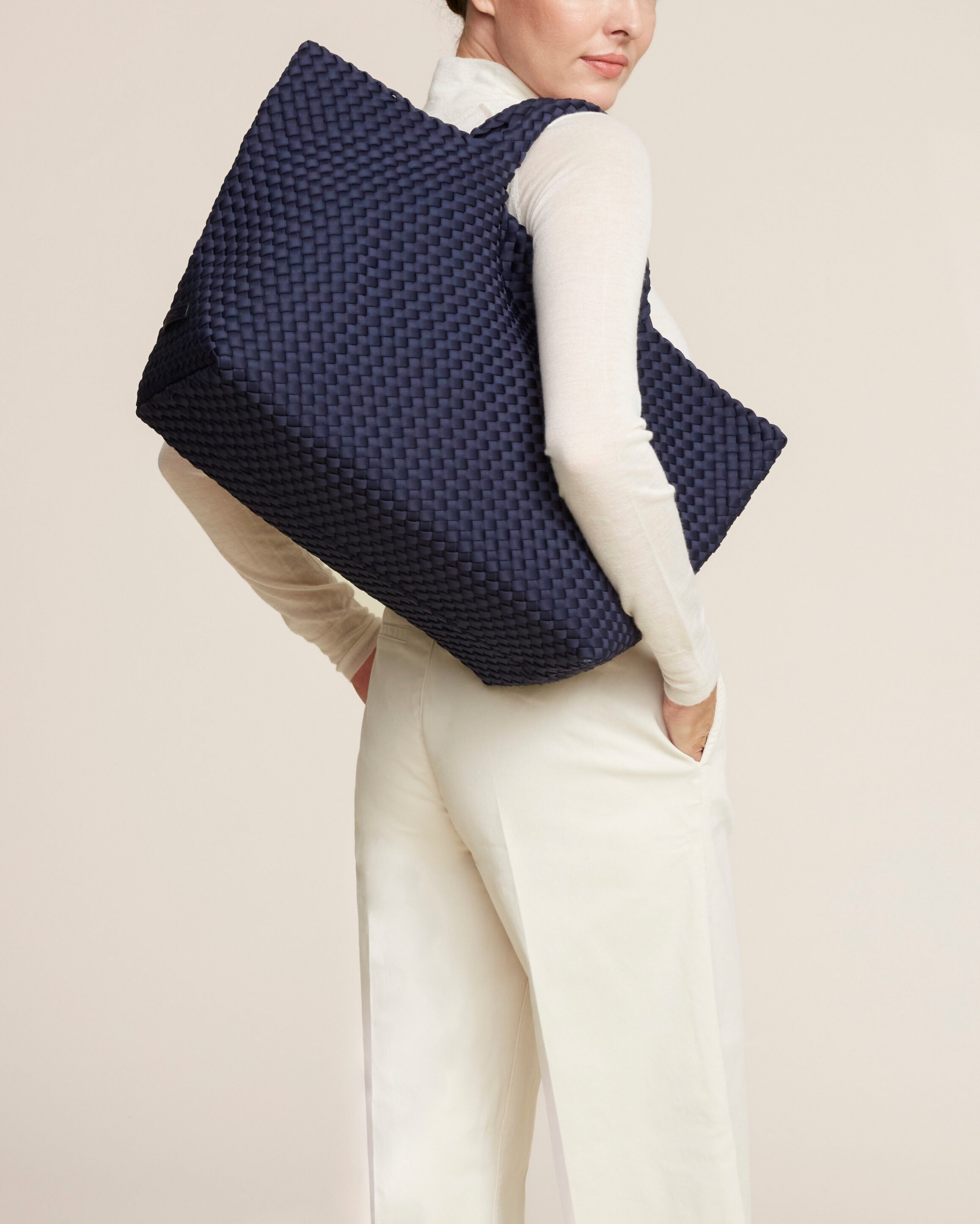 St. Barths Tote in Ink Blue shown on model to illustrate scale and soft silhouette.