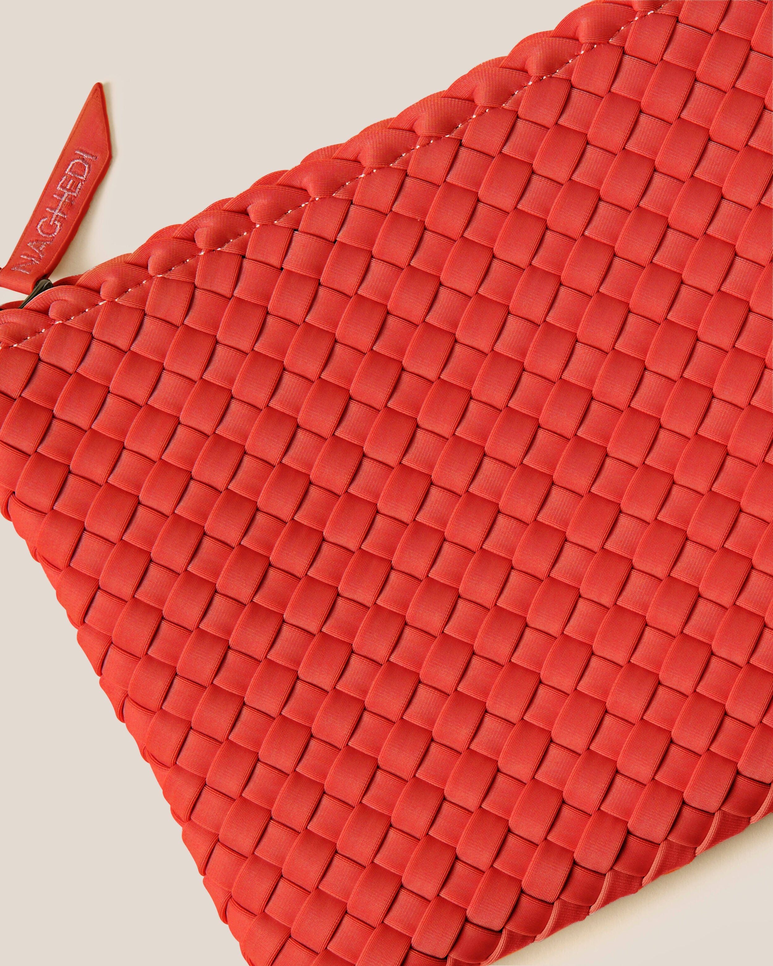 Close-up of included matching woven zippered pouch.