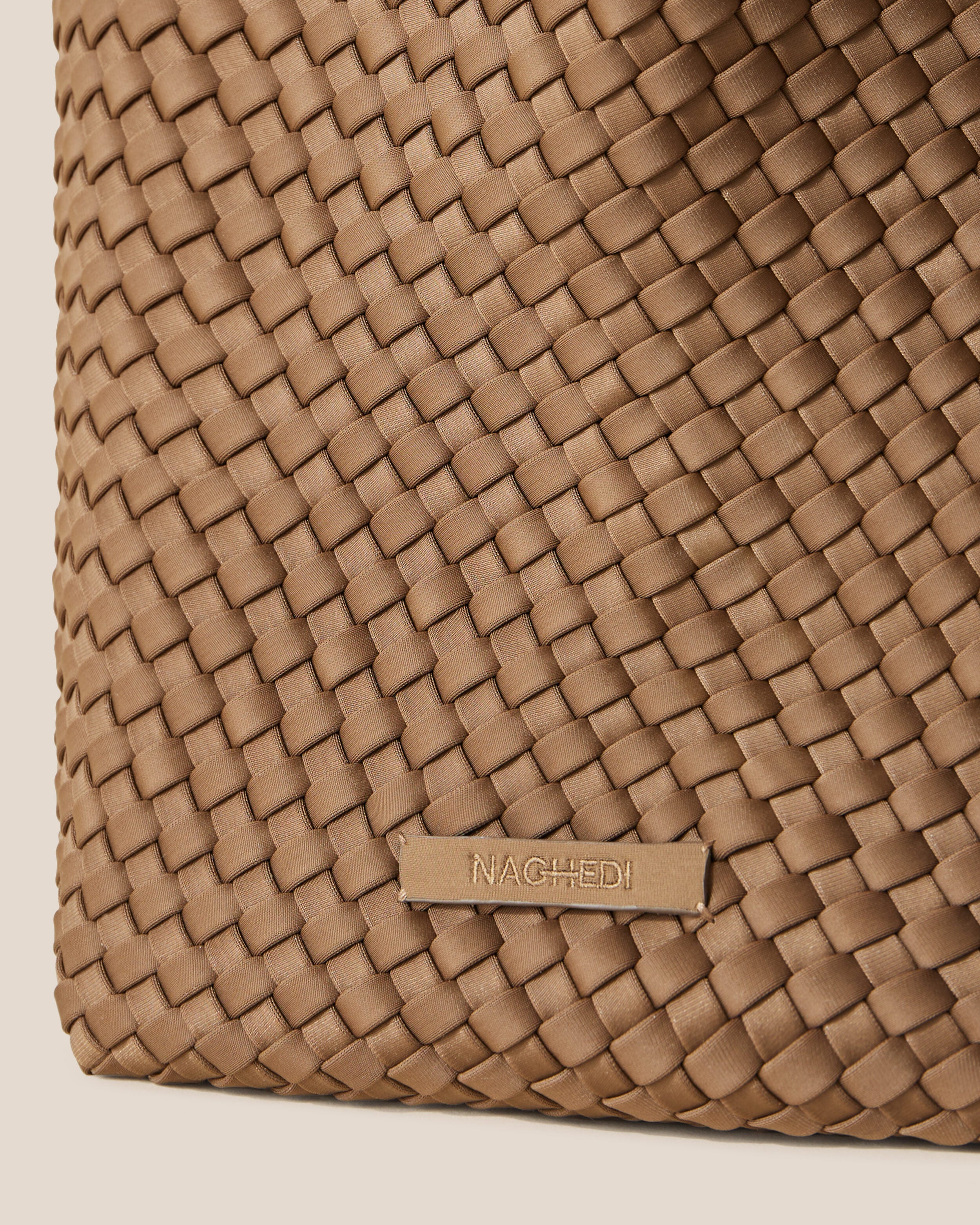 Close-up of stamped NAGHEDI logo on St. Barths Tote in Mink.