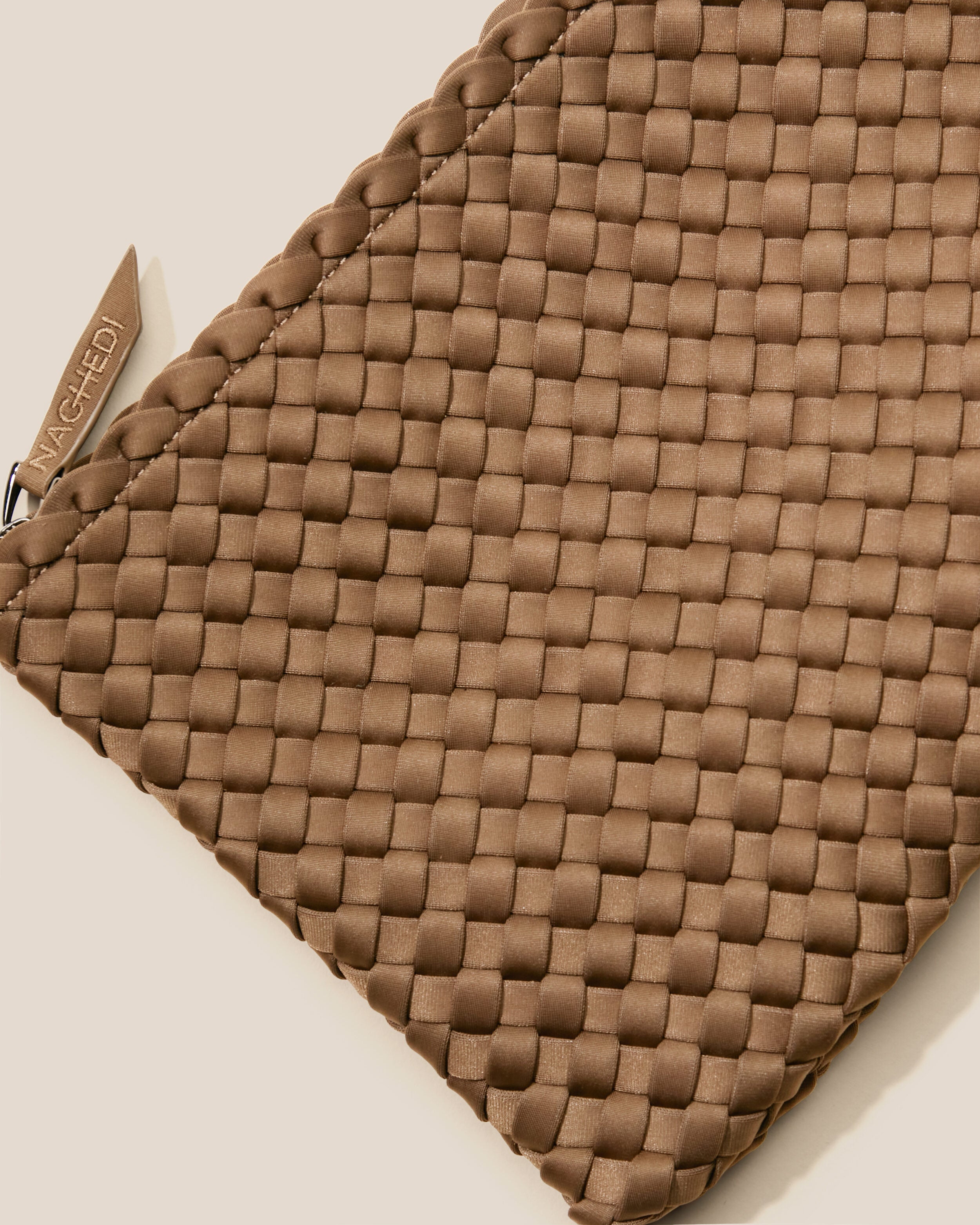 Close-up of included matching woven zippered pouch.