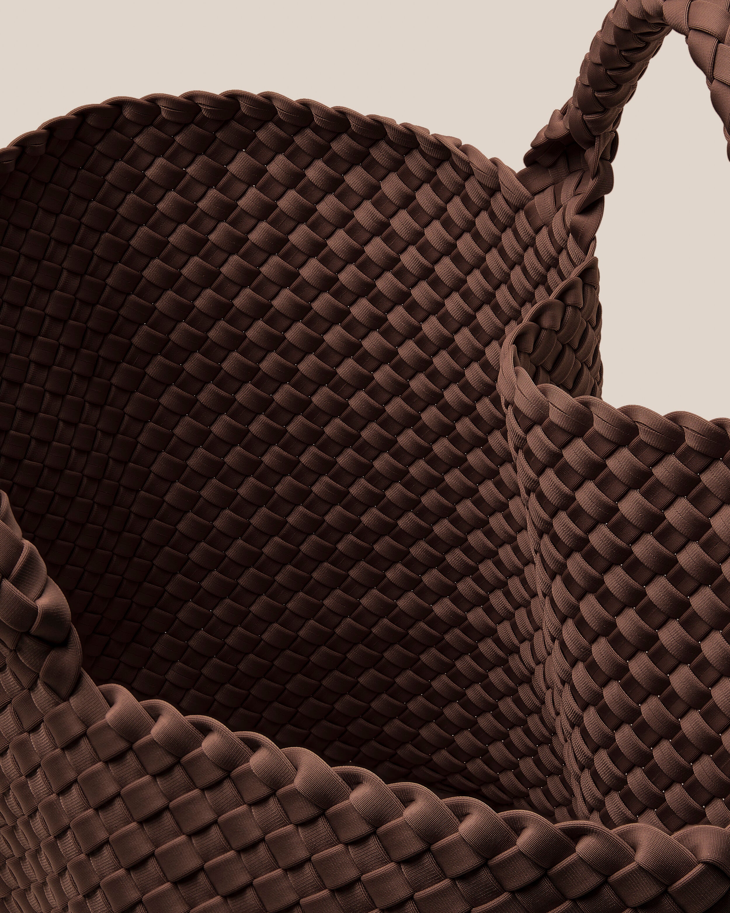 Interior close-up of St. Barths Tote in Mocha showing its open top, and unlined interior.