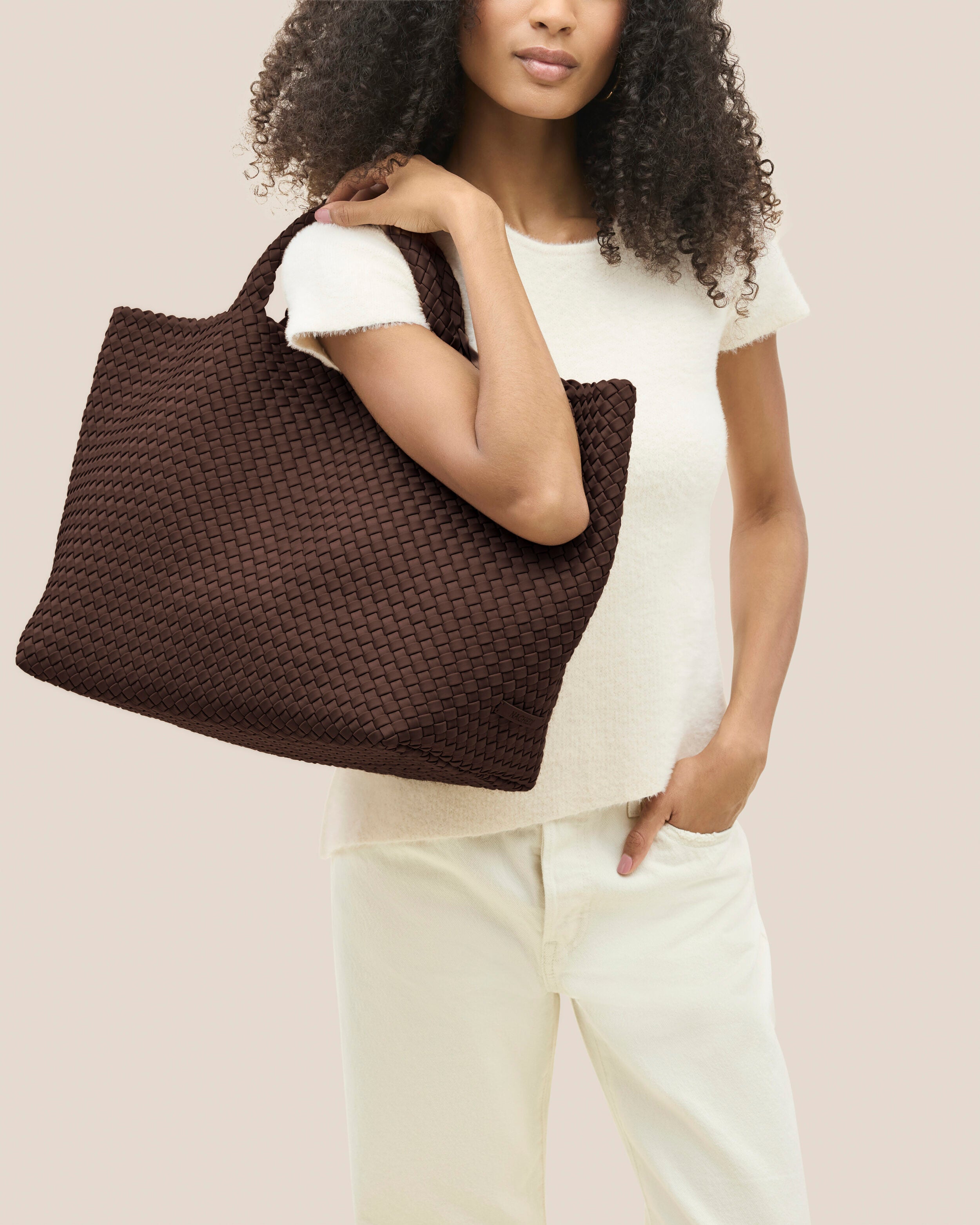 St. Barths Tote in Mocha shown on model to illustrate scale and soft silhouette.