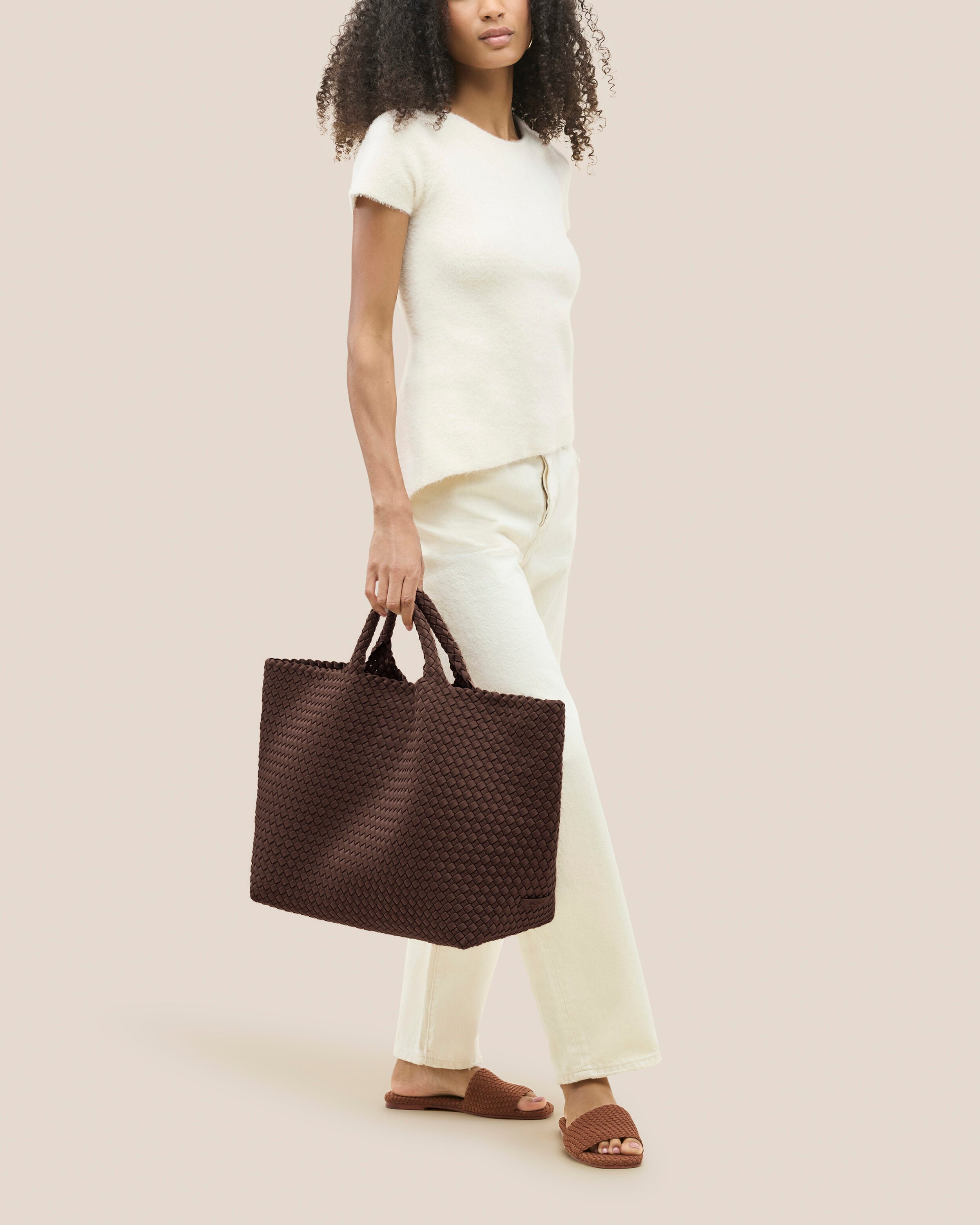 St. Barths Tote in Mocha shown on model to illustrate scale and soft silhouette.