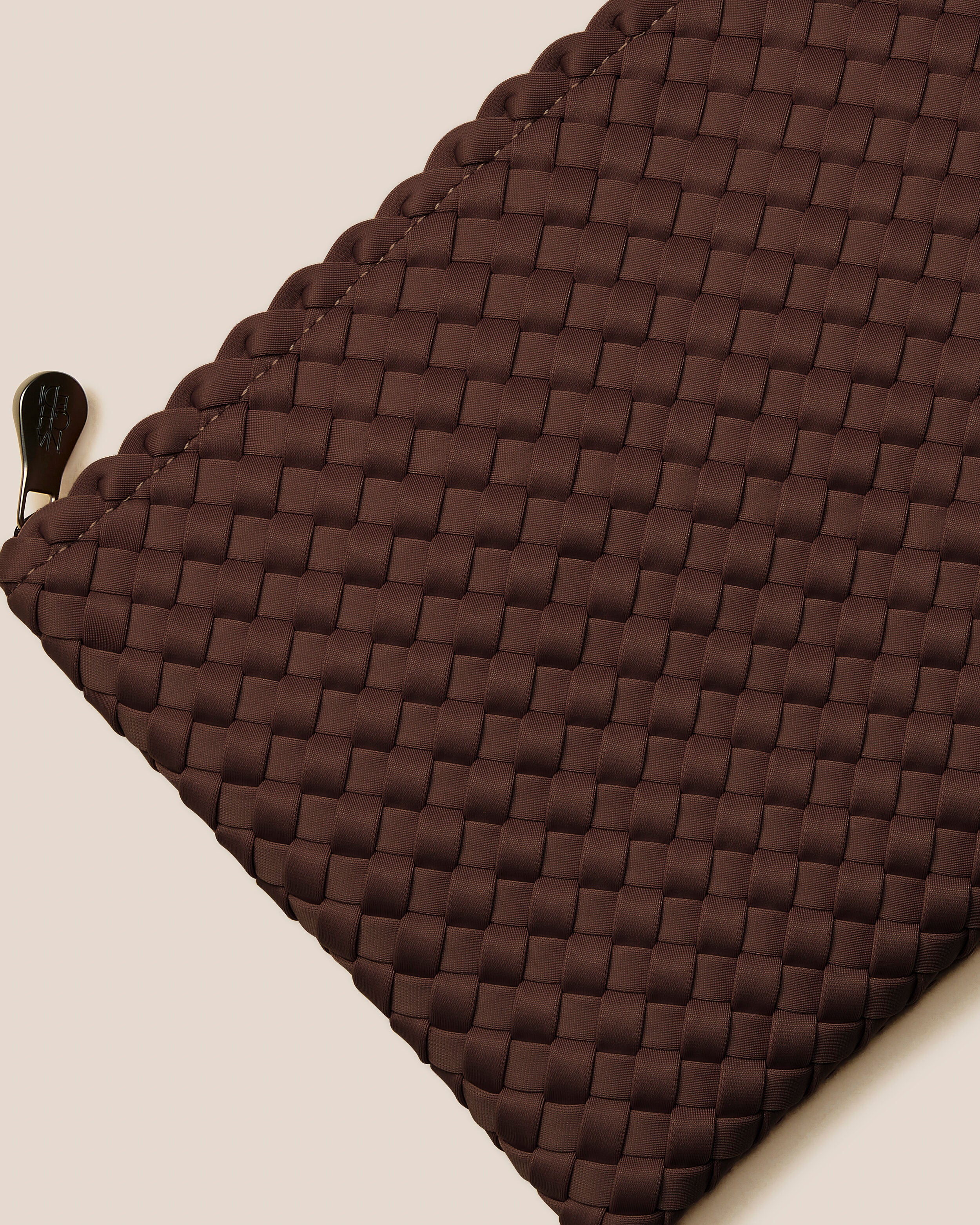 Close-up of included matching woven zippered pouch.