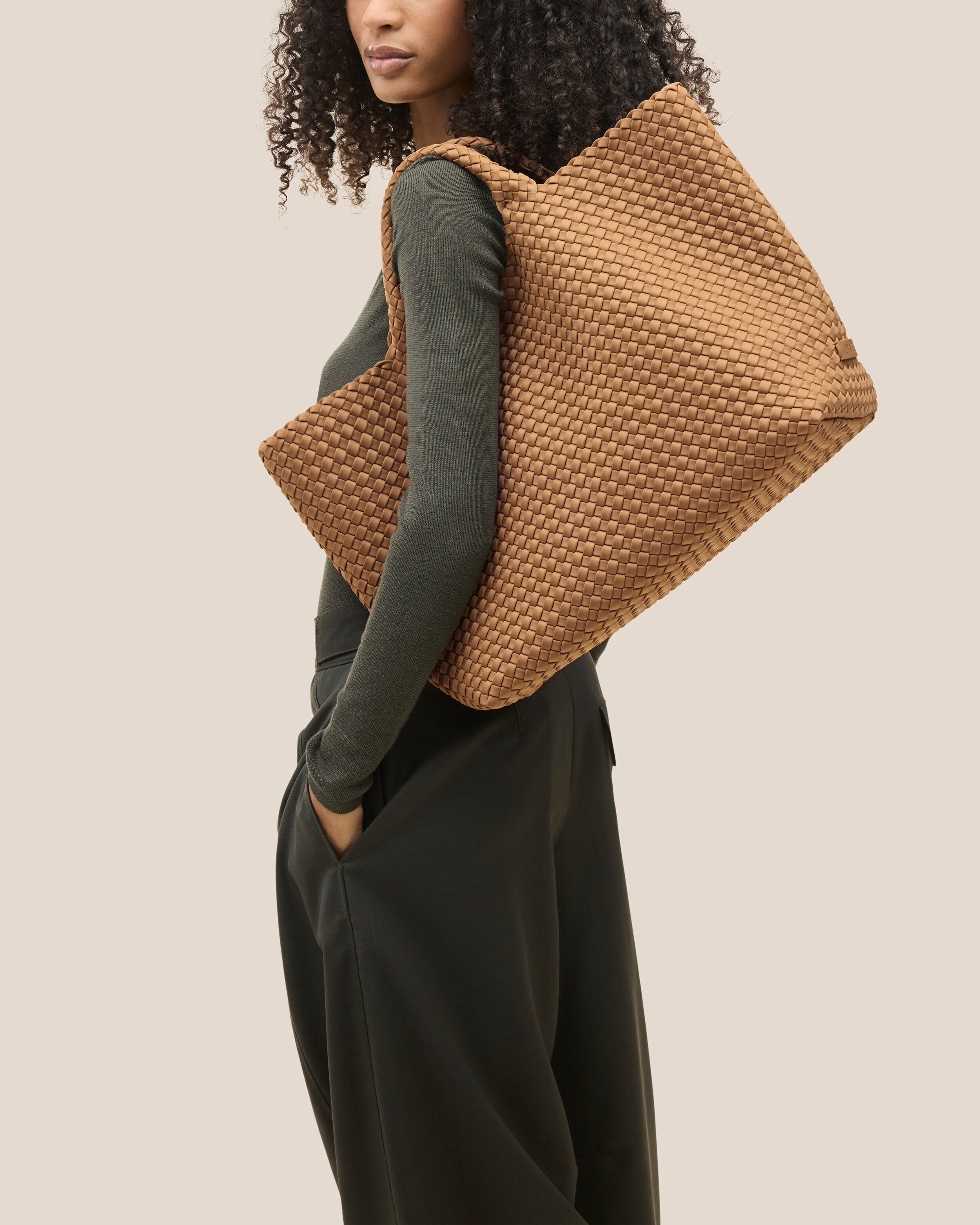 St. Barths Tote in Montauk shown on model to illustrate scale and soft silhouette.