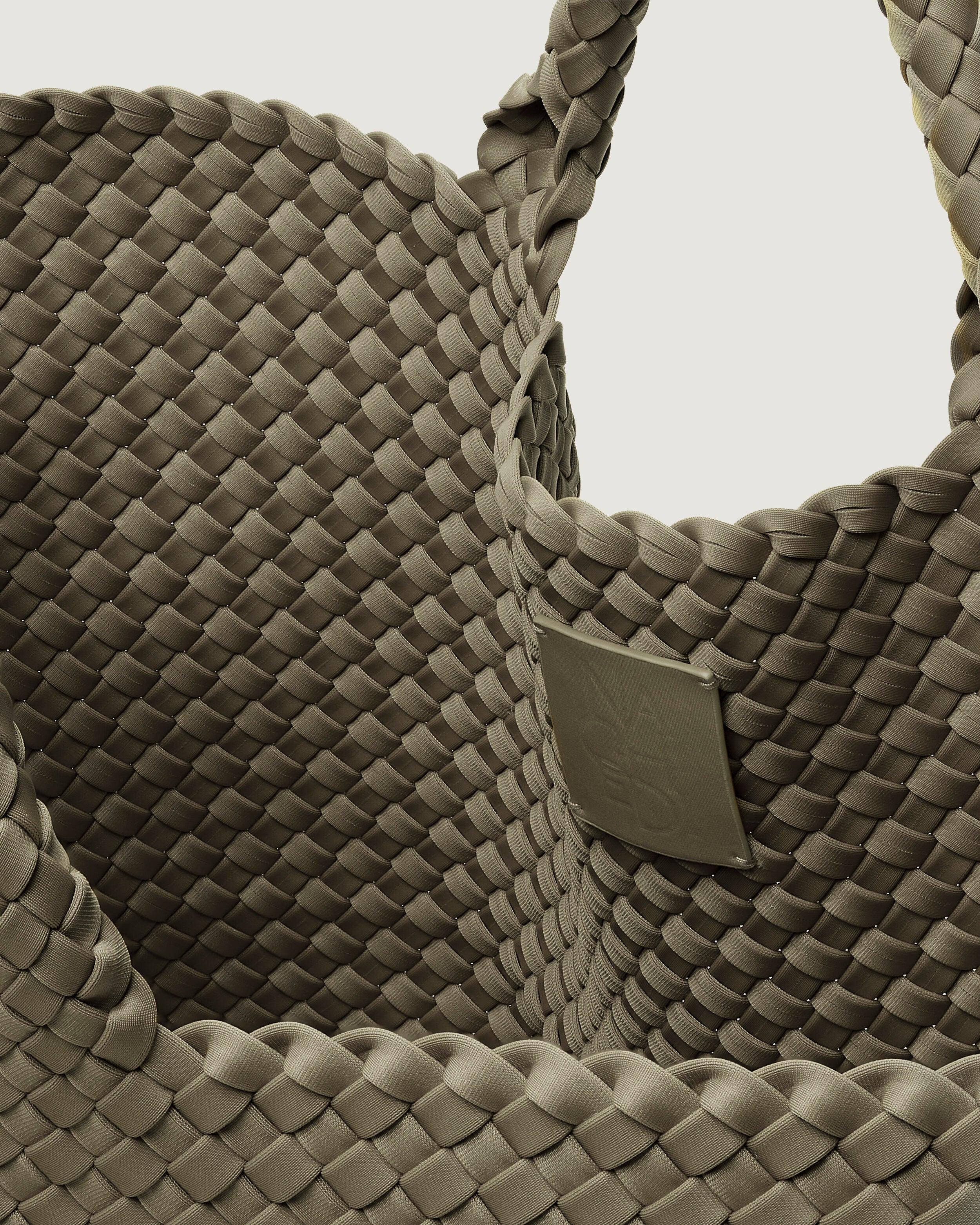 Interior close-up of St. Barths Tote in Olea showing its open top, and unlined interior.