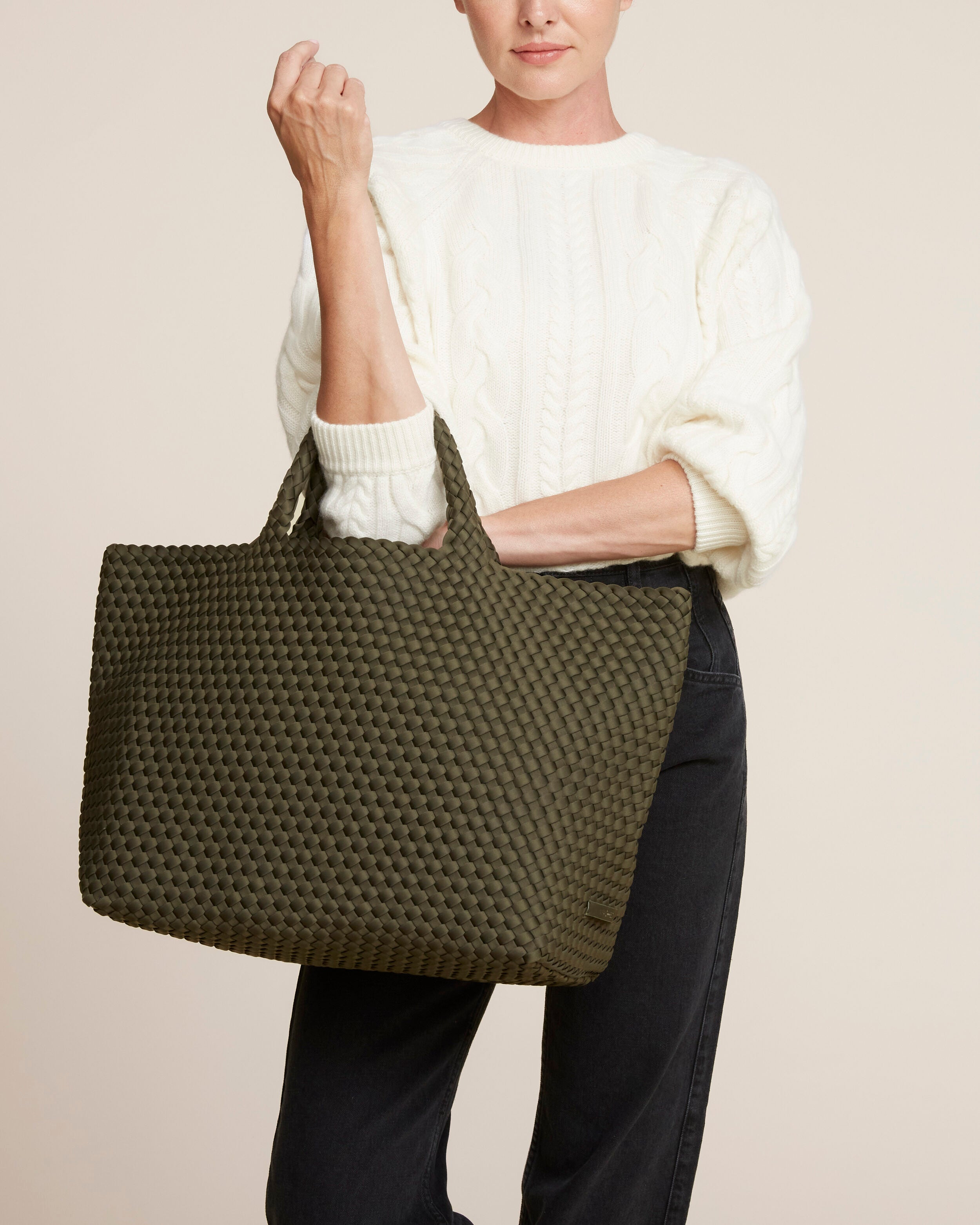 St. Barths Tote in Olive shown on model to illustrate scale and soft silhouette.