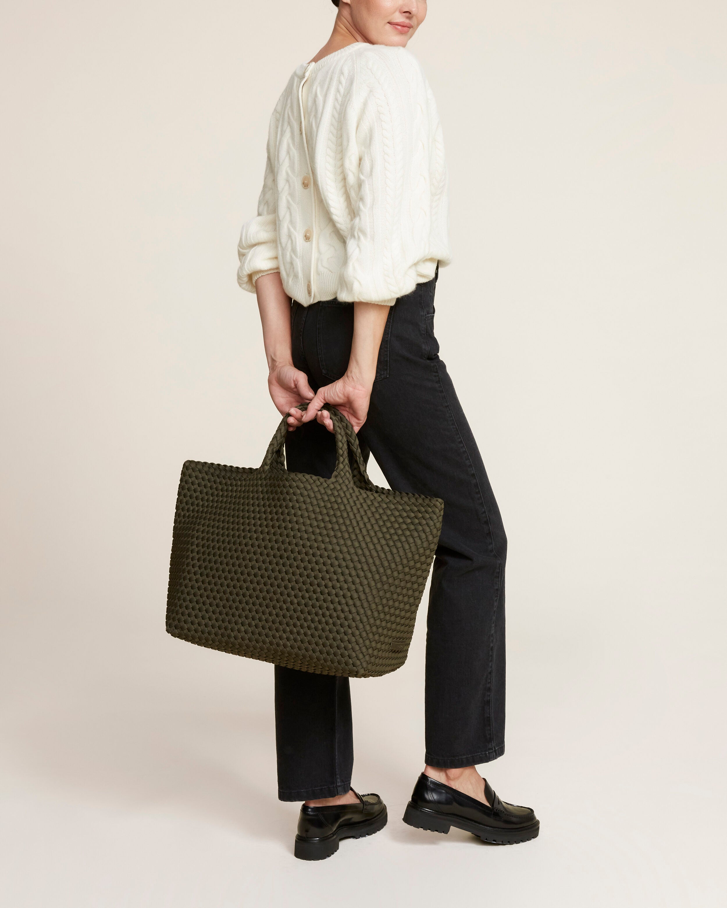 St. Barths Tote in Olive shown on model to illustrate scale and soft silhouette.