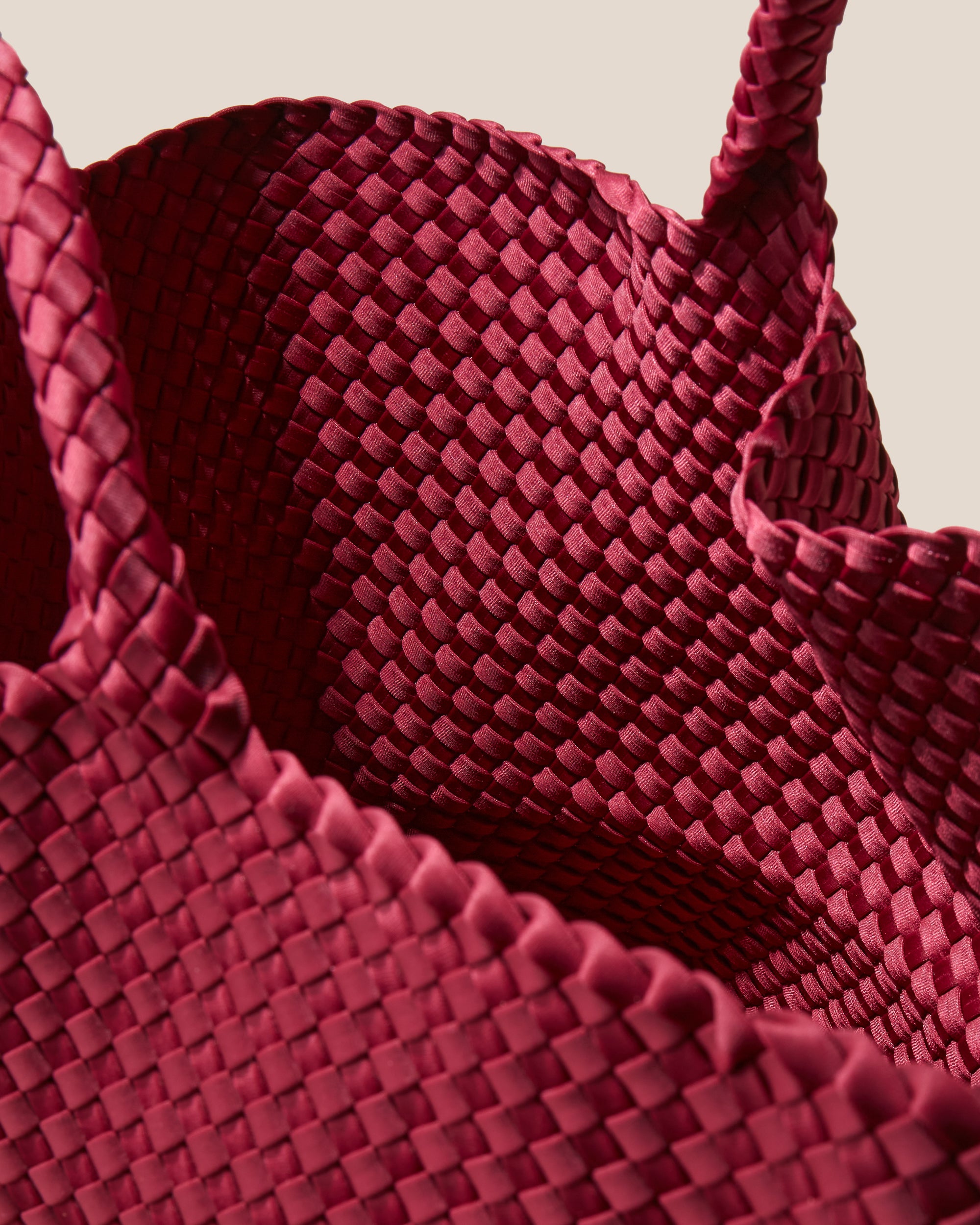 Interior close-up of St. Barths Tote in Rosewood showing its open top, and unlined interior.