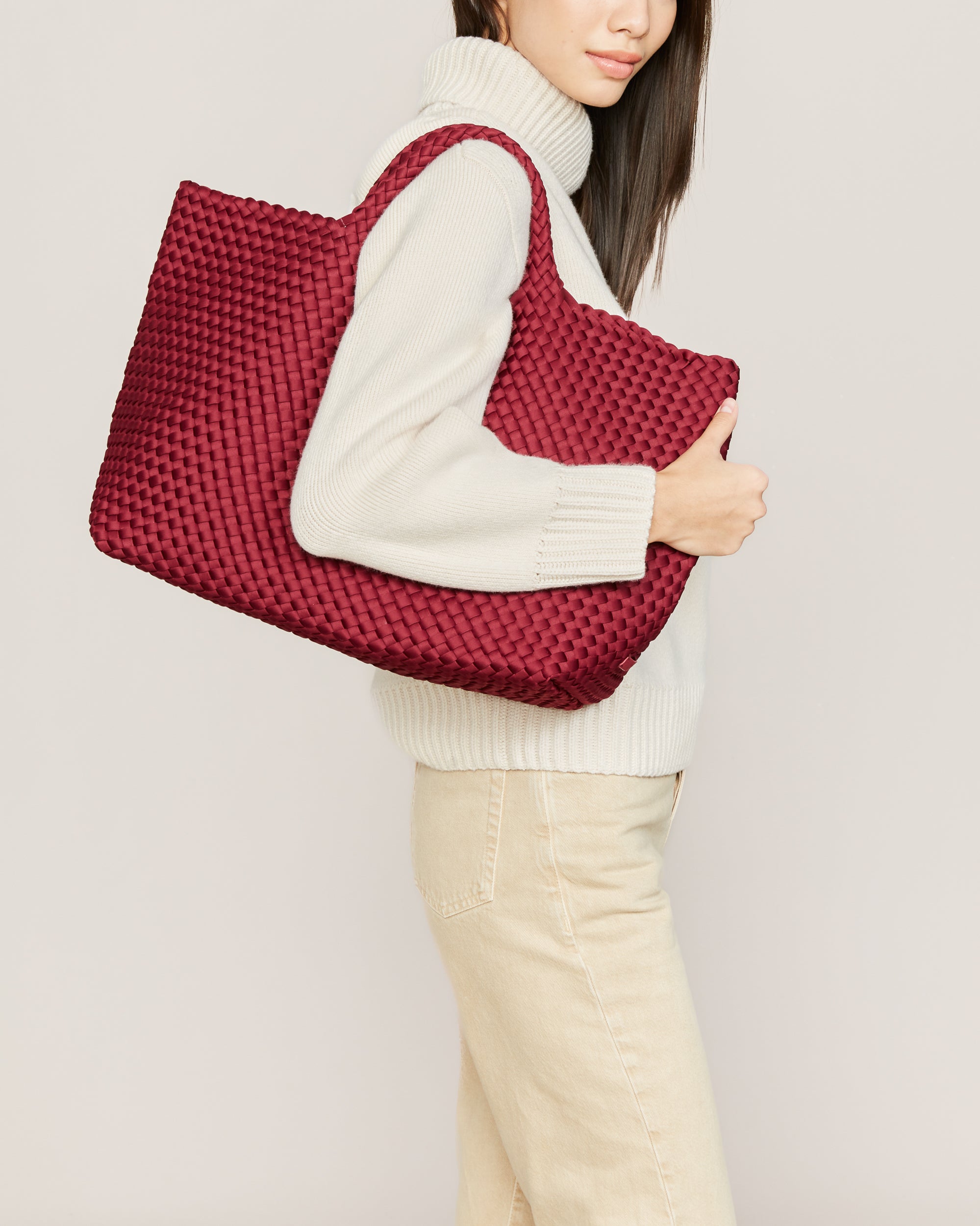 St. Barths Tote in Rosewood shown on model to illustrate scale and soft silhouette.