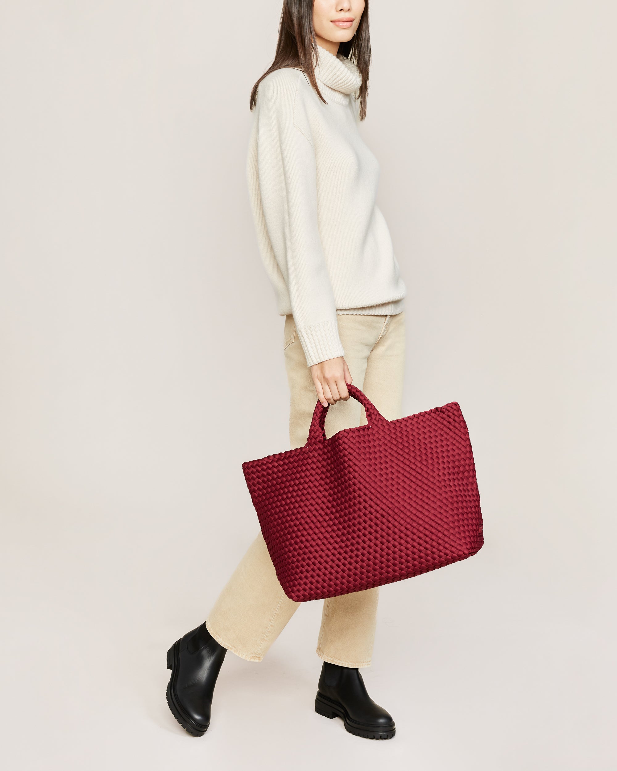 St. Barths Tote in Rosewood shown on model to illustrate scale and soft silhouette.