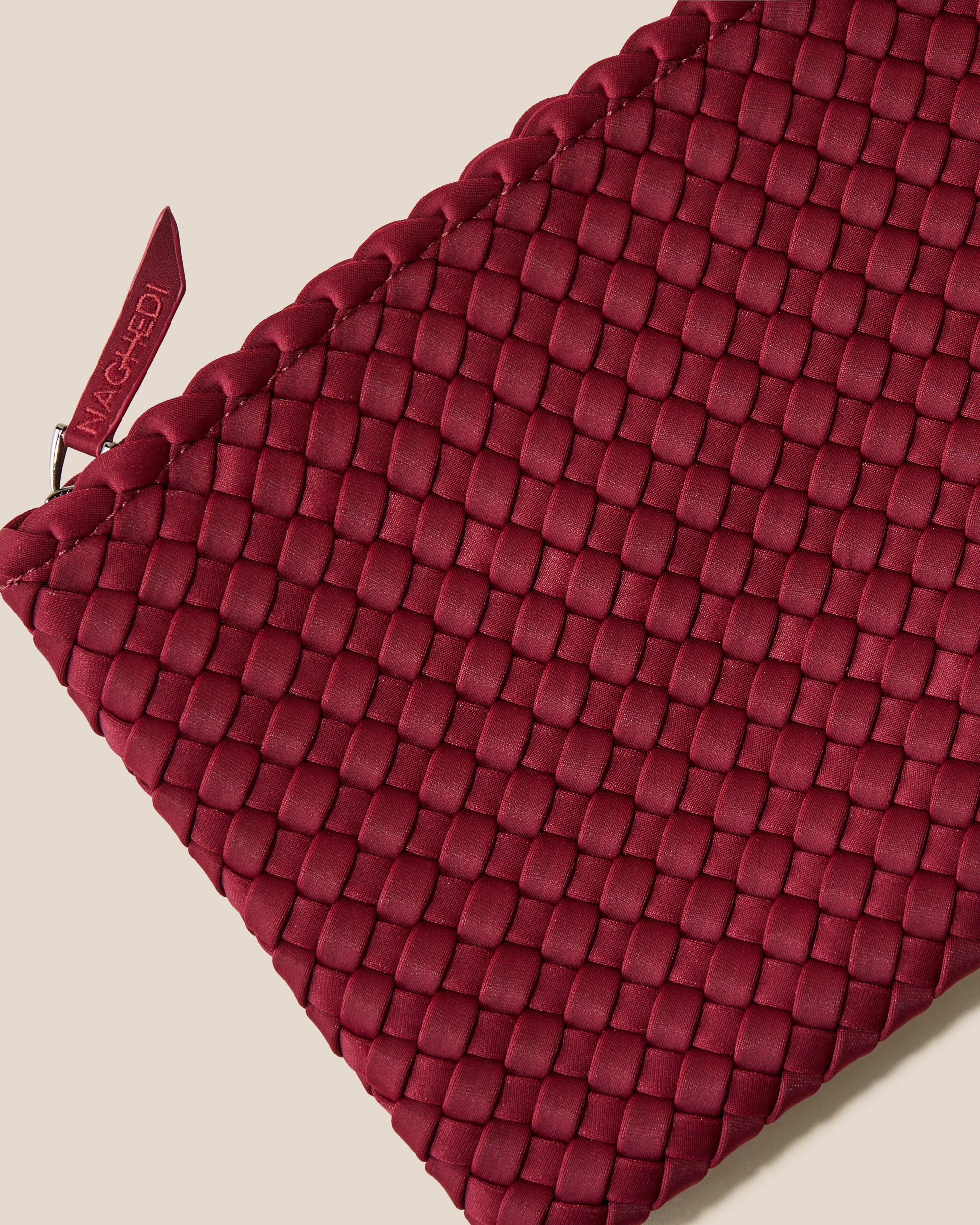 Close-up of included matching woven zippered pouch.