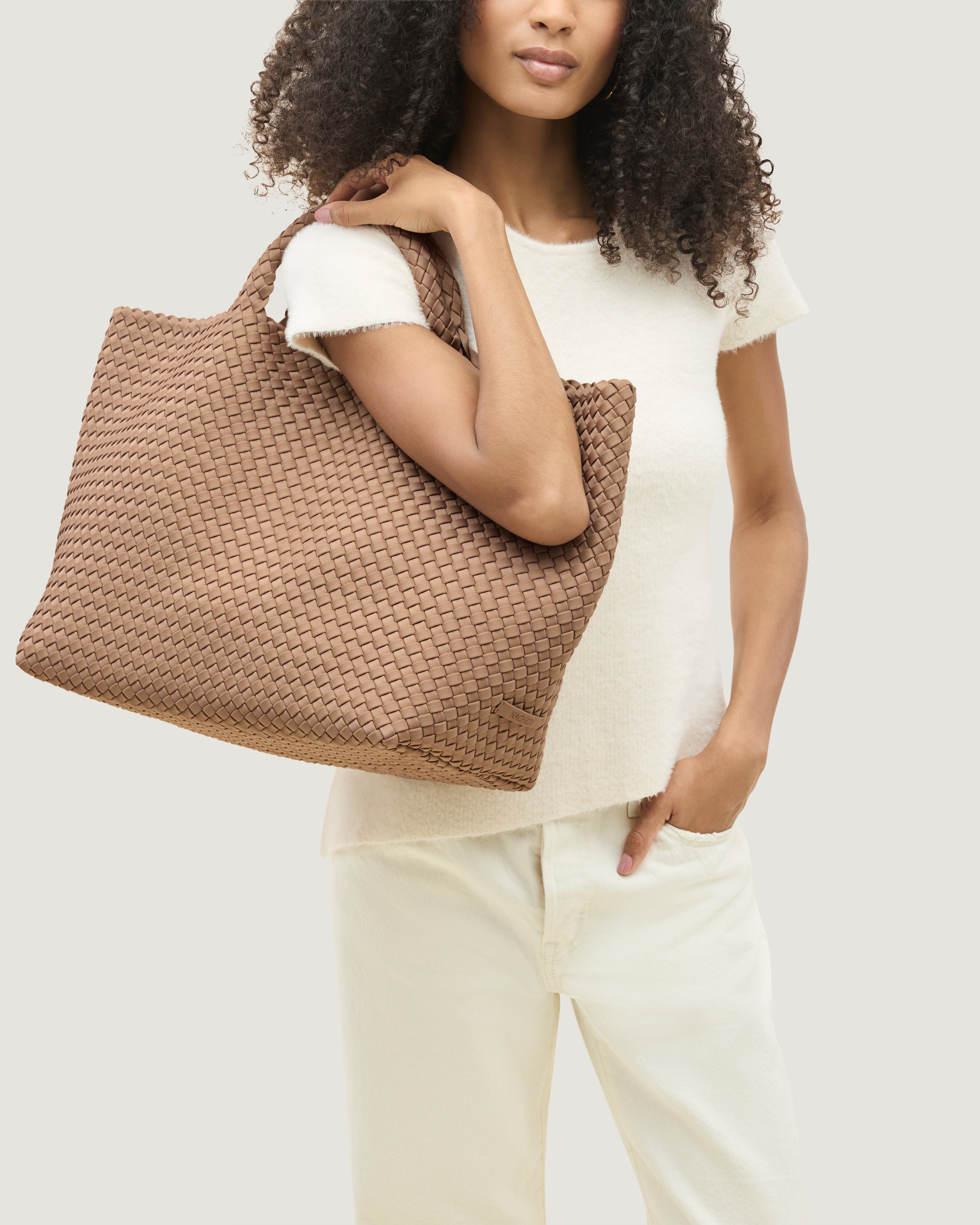 St. Barths Tote in Seychelles shown on model to illustrate scale and soft silhouette.