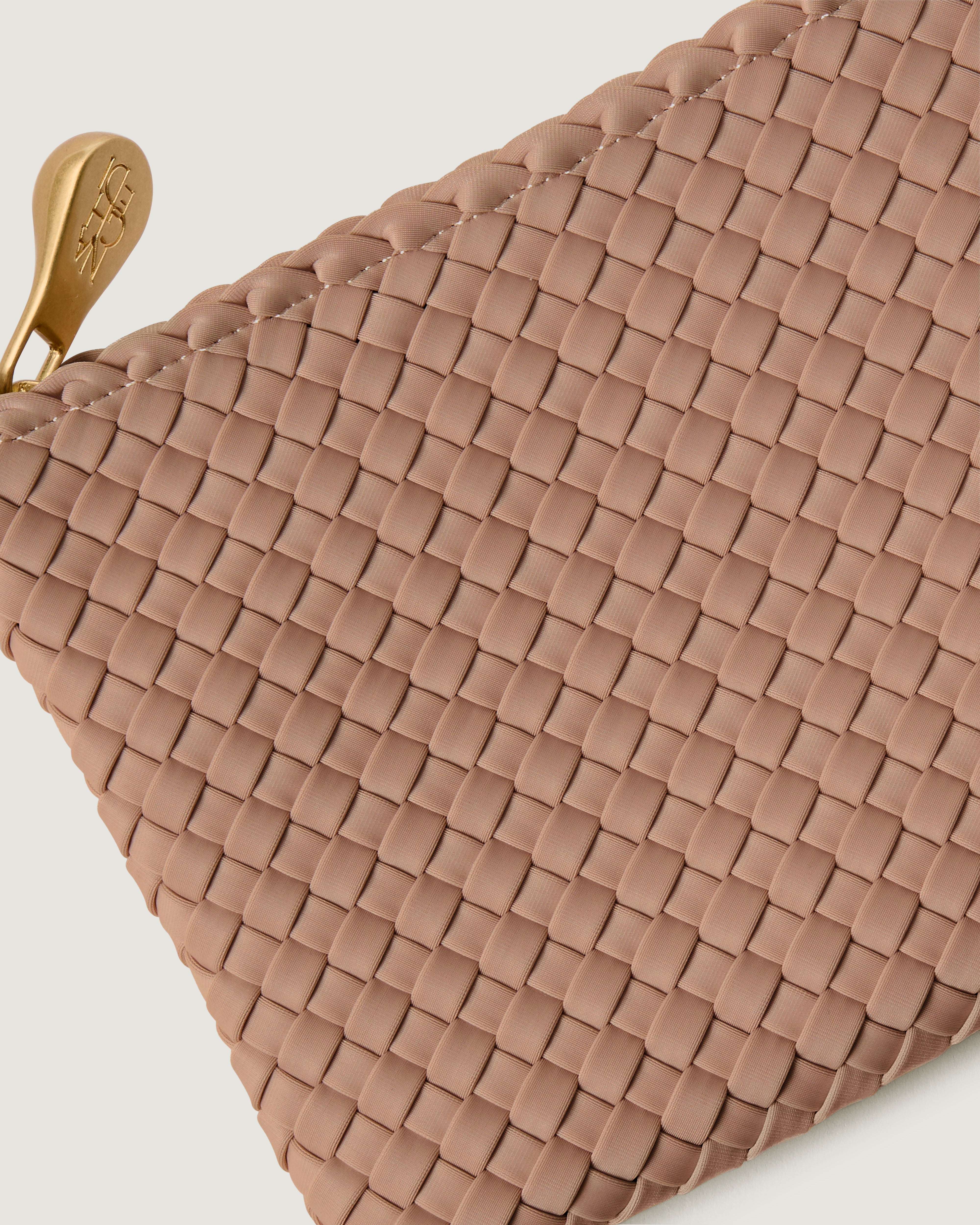 Close-up of included matching woven zippered pouch.