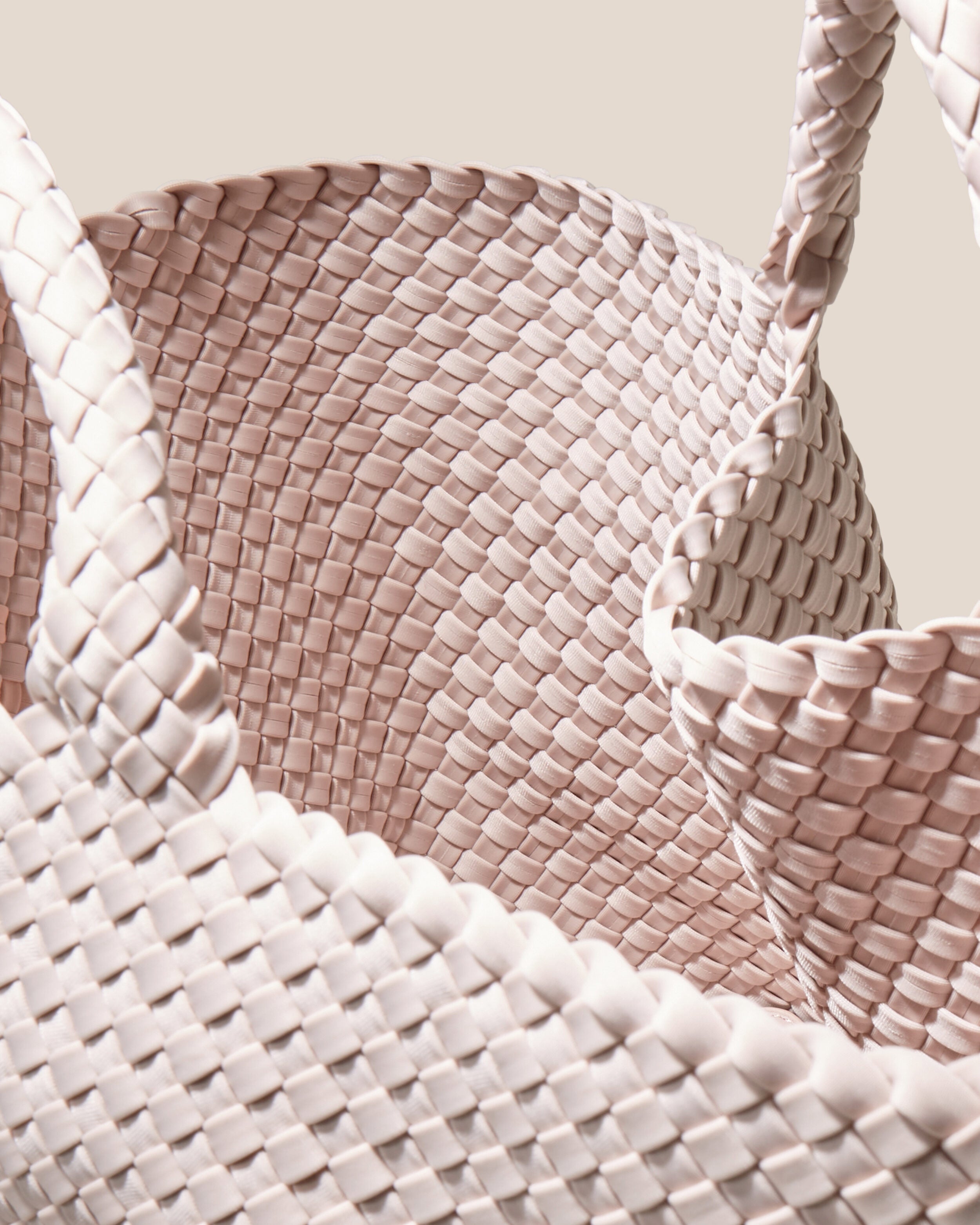 Interior close-up of St. Barths Tote in Shell Pink showing its open top, and unlined interior.