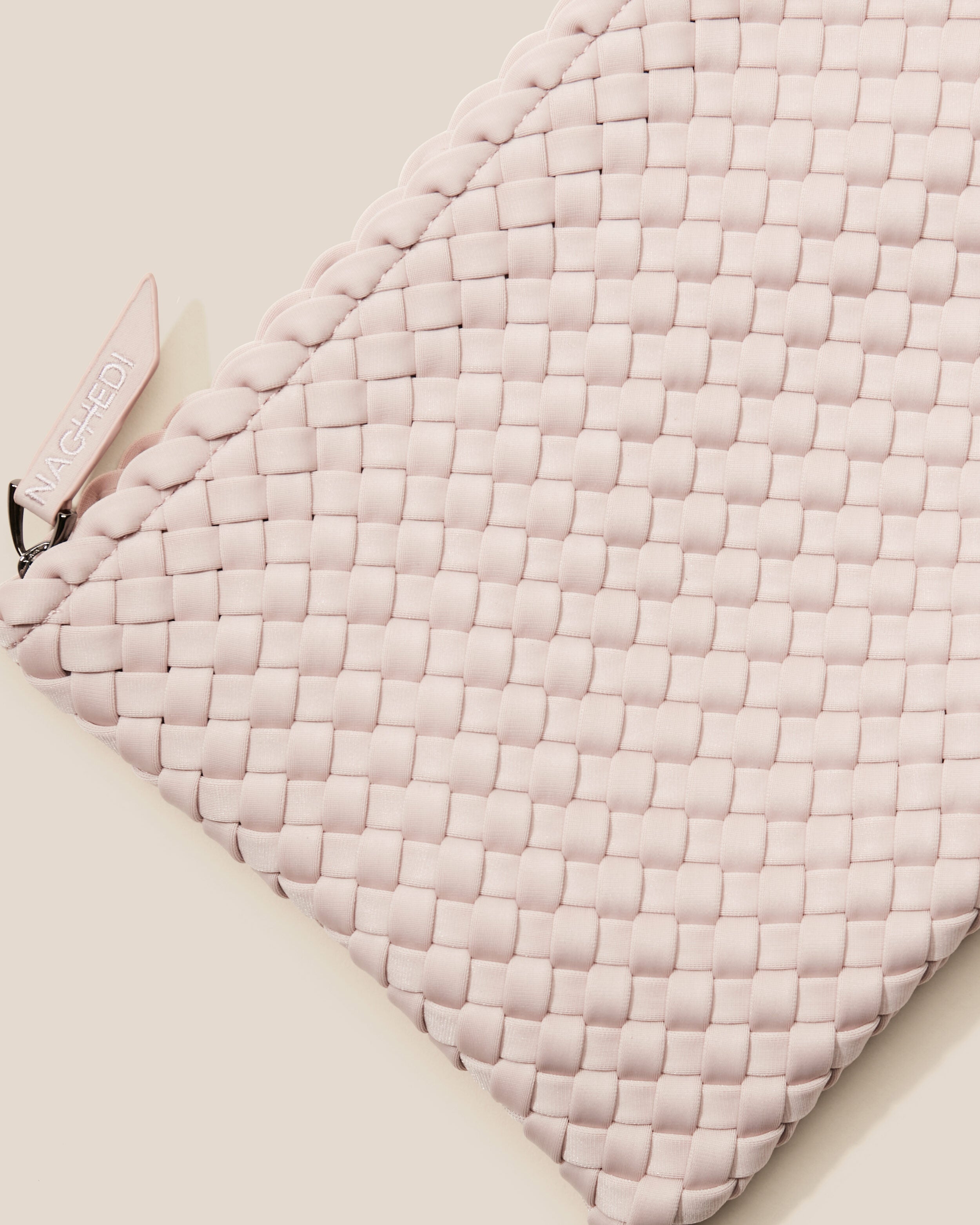 Close-up of included matching woven zippered pouch.