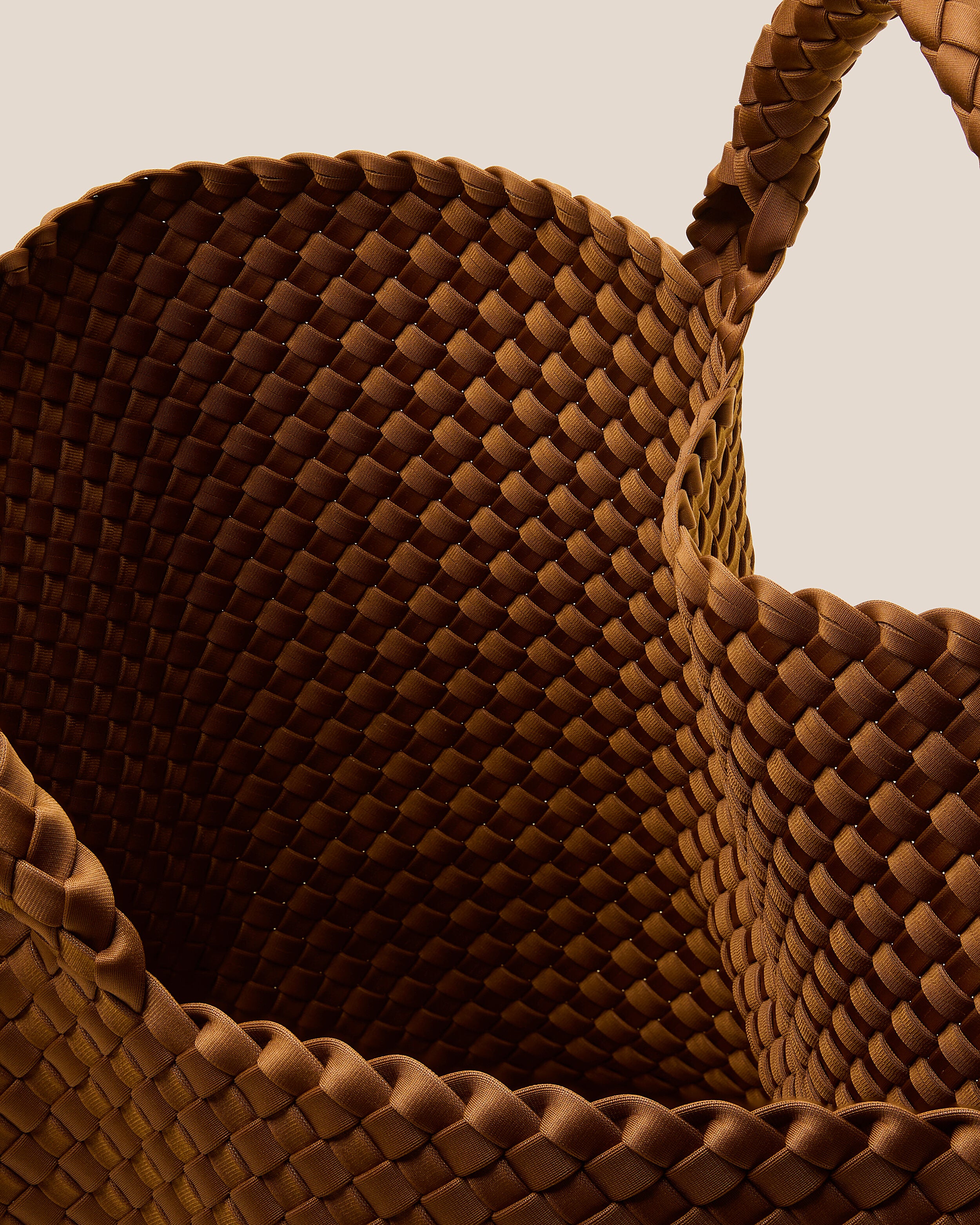 Interior close-up of St. Barths Tote in Teak showing its open top, and unlined interior.