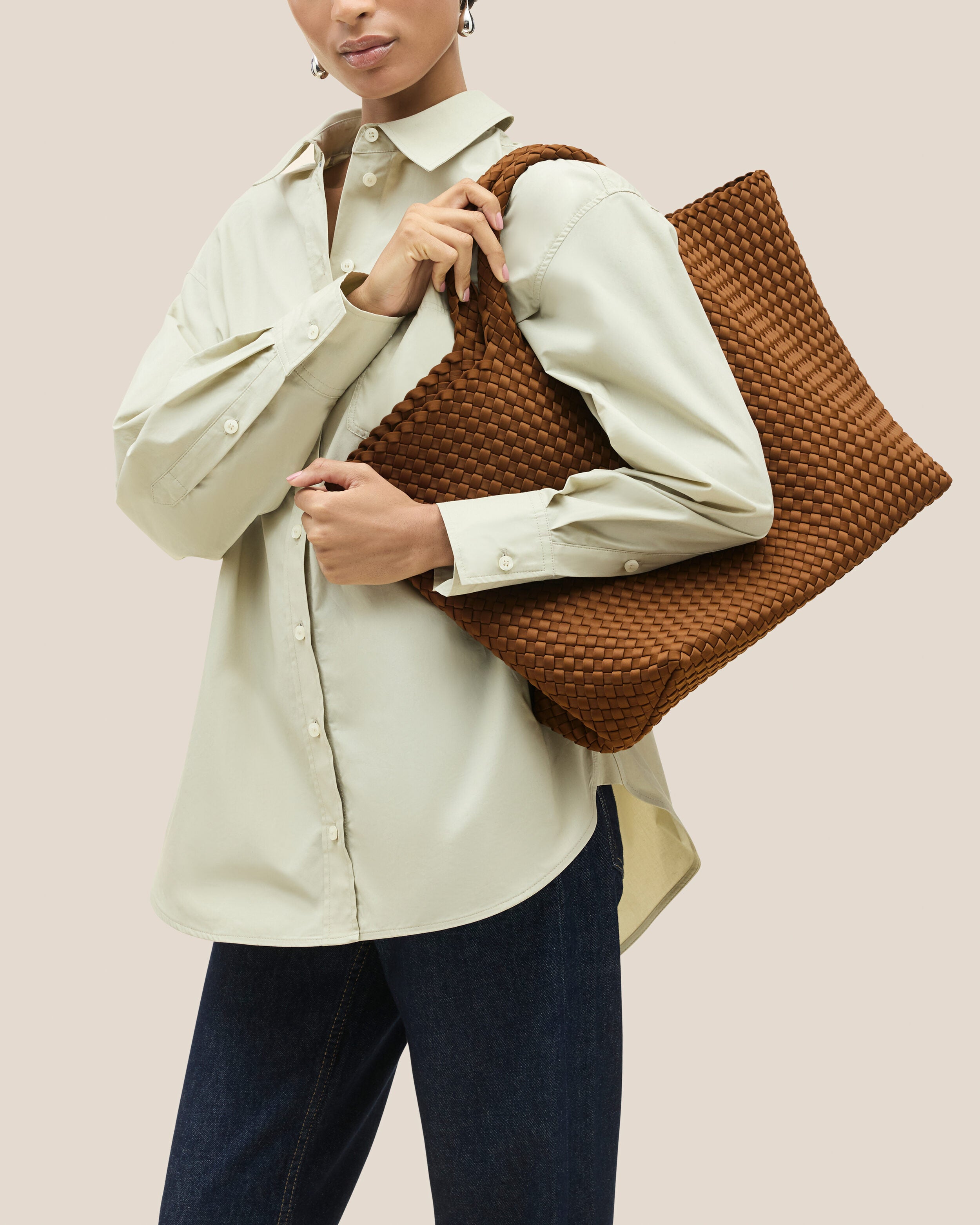 St. Barths Tote in Teak shown on model to illustrate scale and soft silhouette.