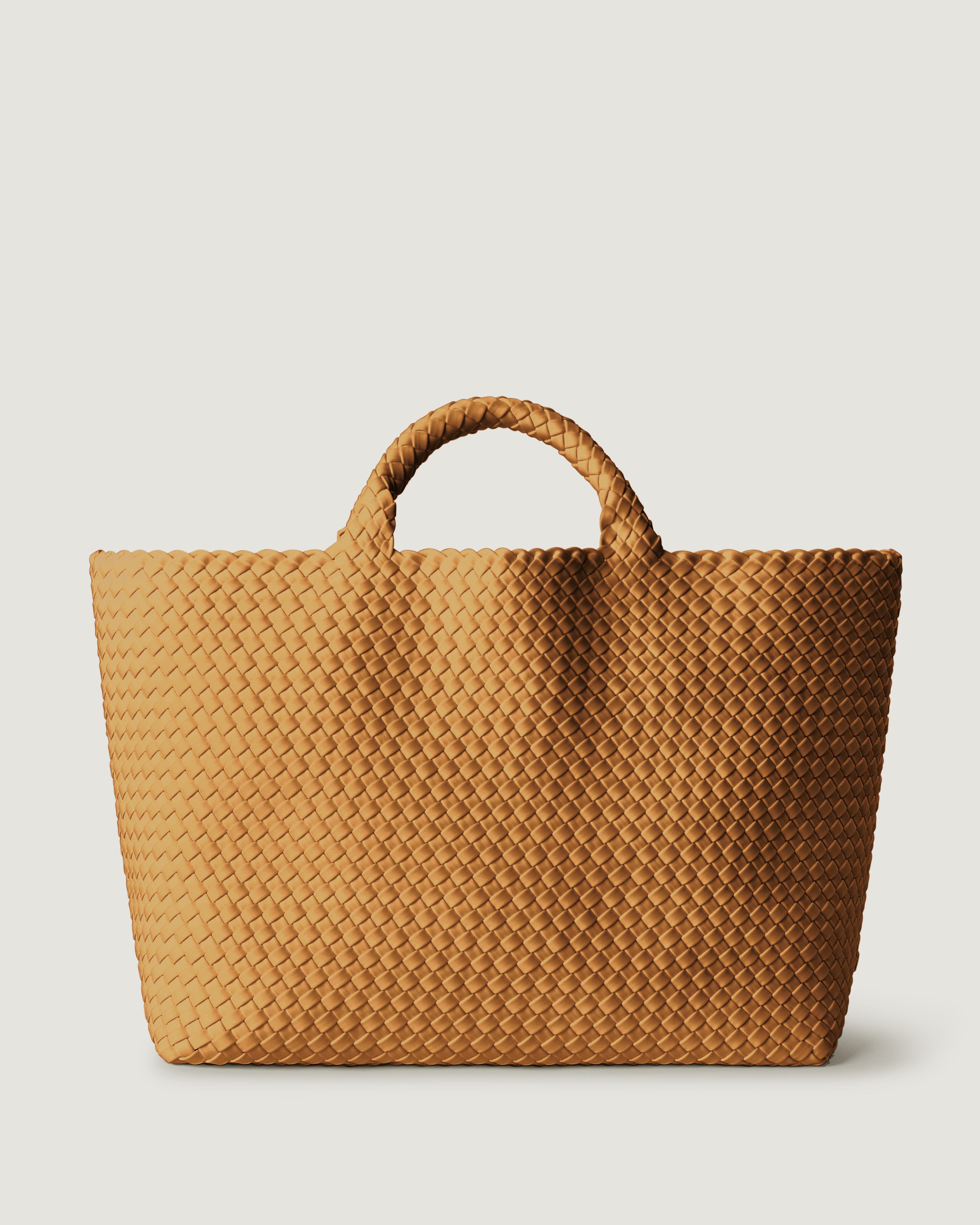 St. Barths Tote in Turmeric, handwoven in golden chartreuse neoprene. Featuring an open top, and woven top handles.
