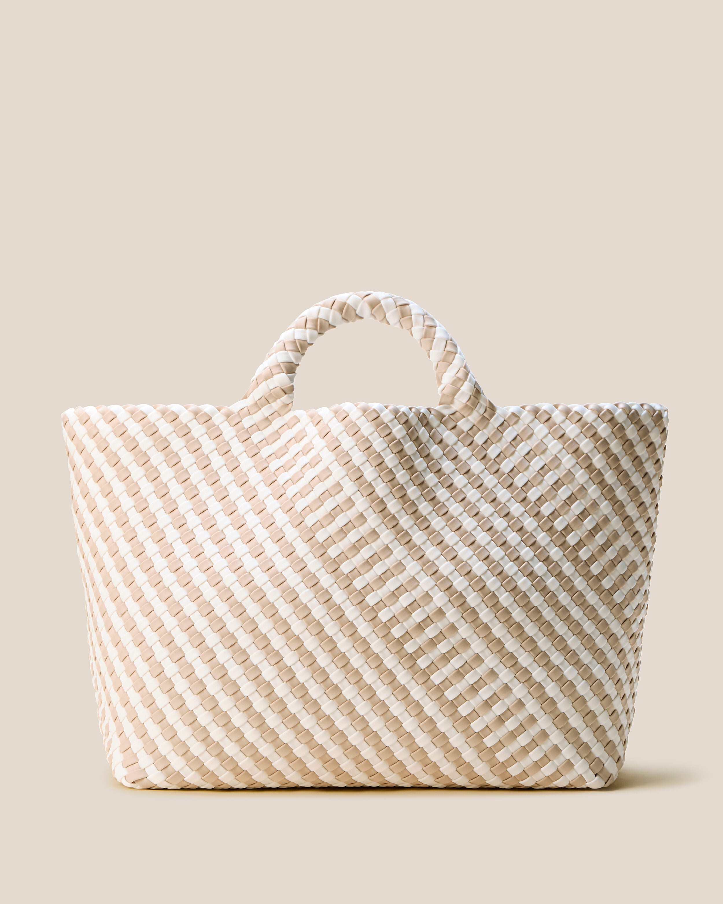 St. Barths Tote in Mykonos, a cream and ivory tone, in handwoven neoprene, featuring an open top, and woven top handles.