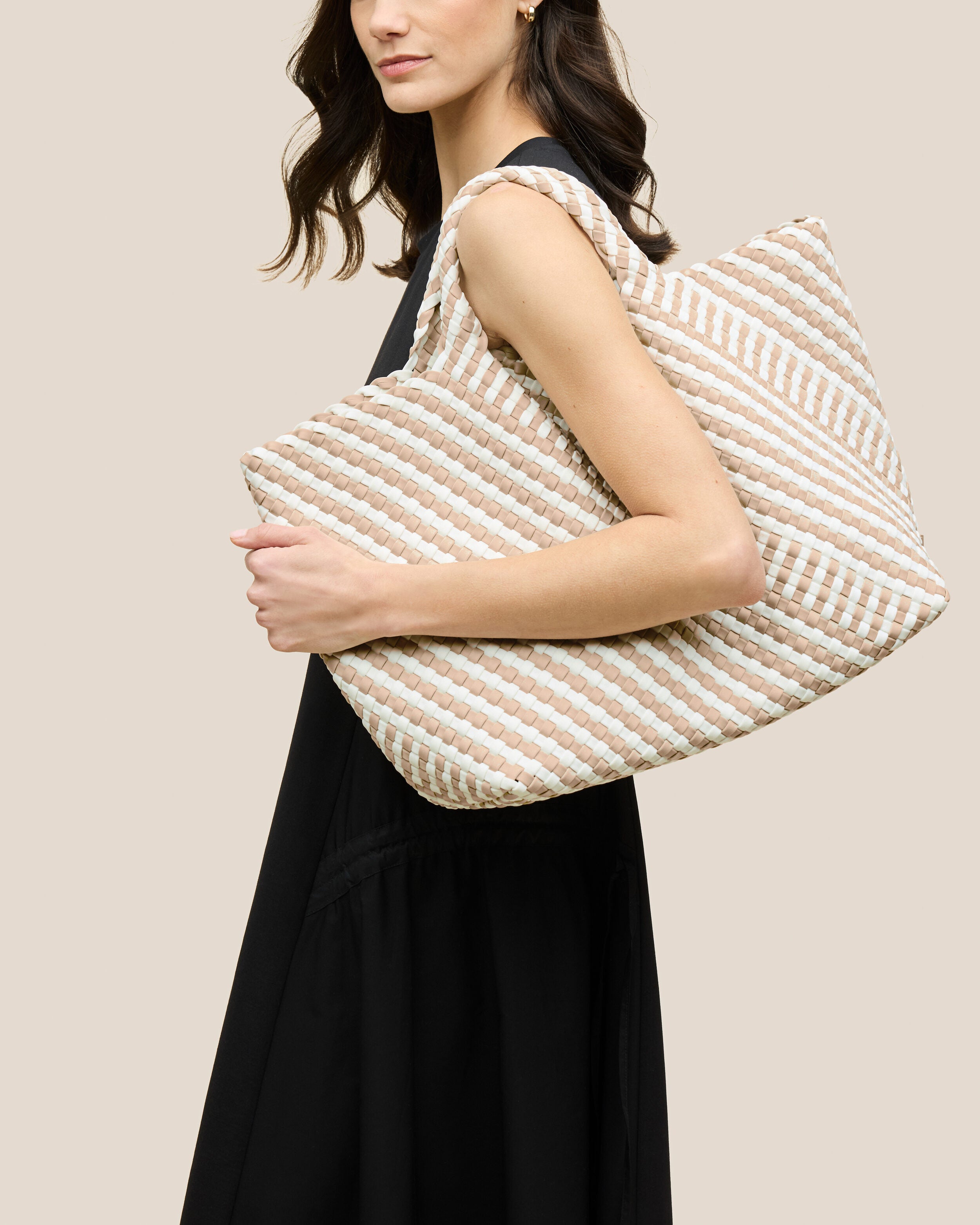 St. Barths Tote in Mykonos shown on model to illustrate scale and soft silhouette.