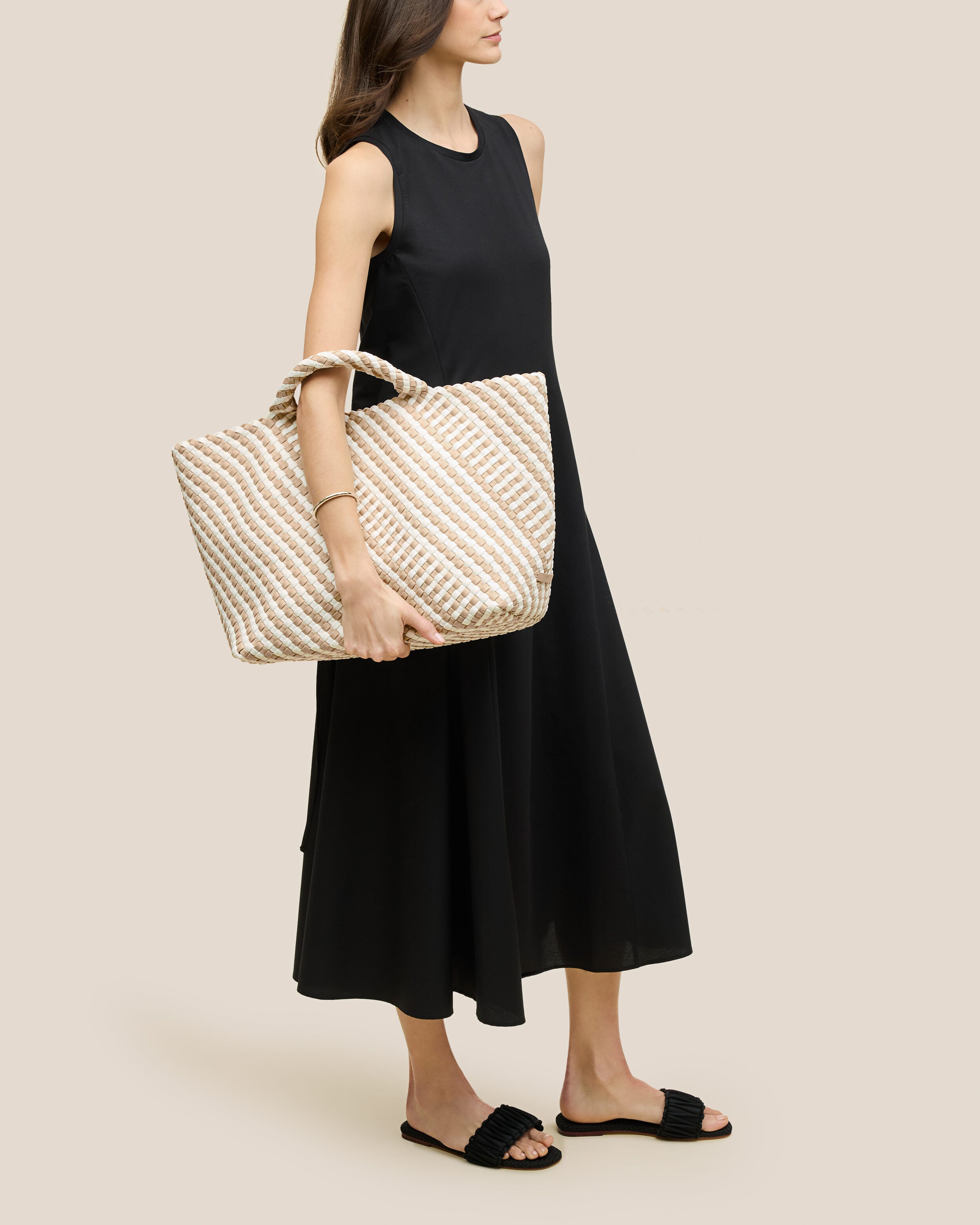 St. Barths Tote in Mykonos shown on model to illustrate scale and soft silhouette.