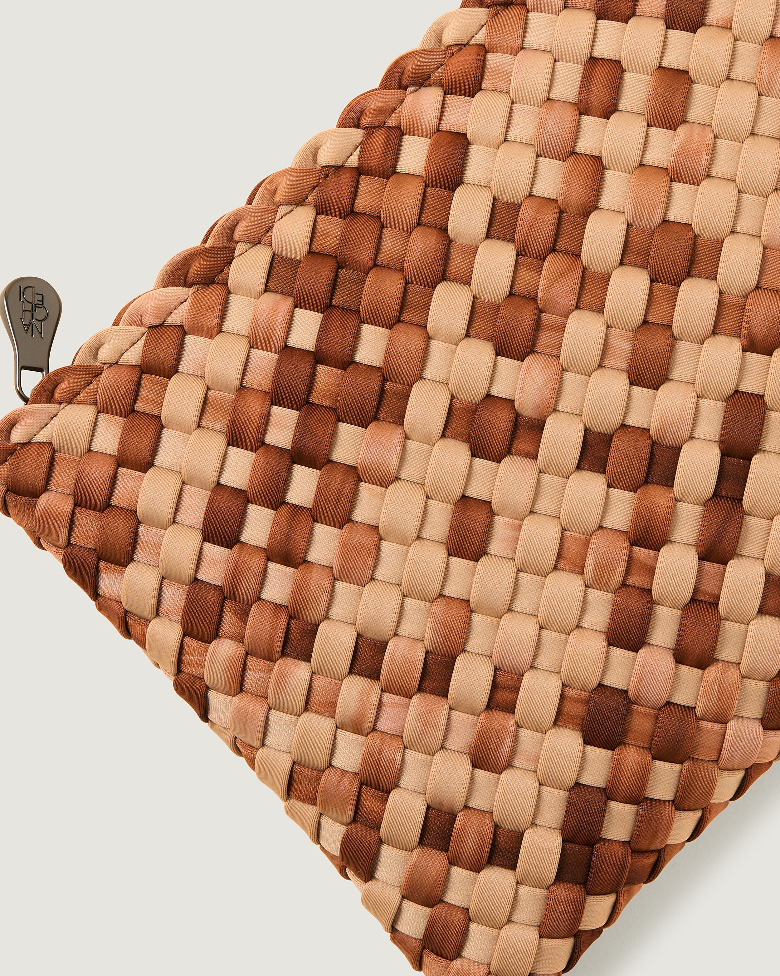 Close-up of included matching woven zippered pouch.