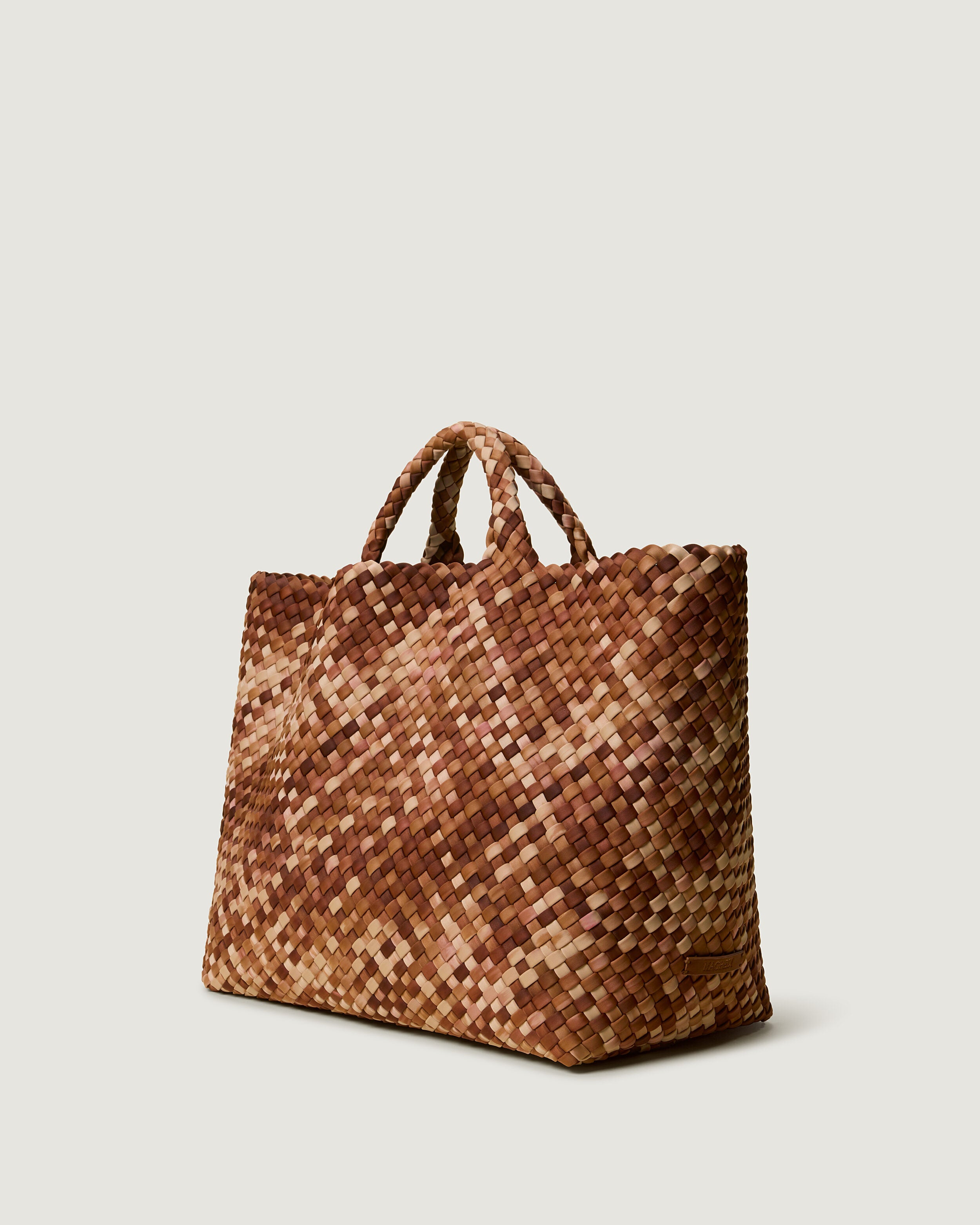 St. Barths Tote in Fez shown from a side angle, highlighting its handwoven neoprene construction and open top.