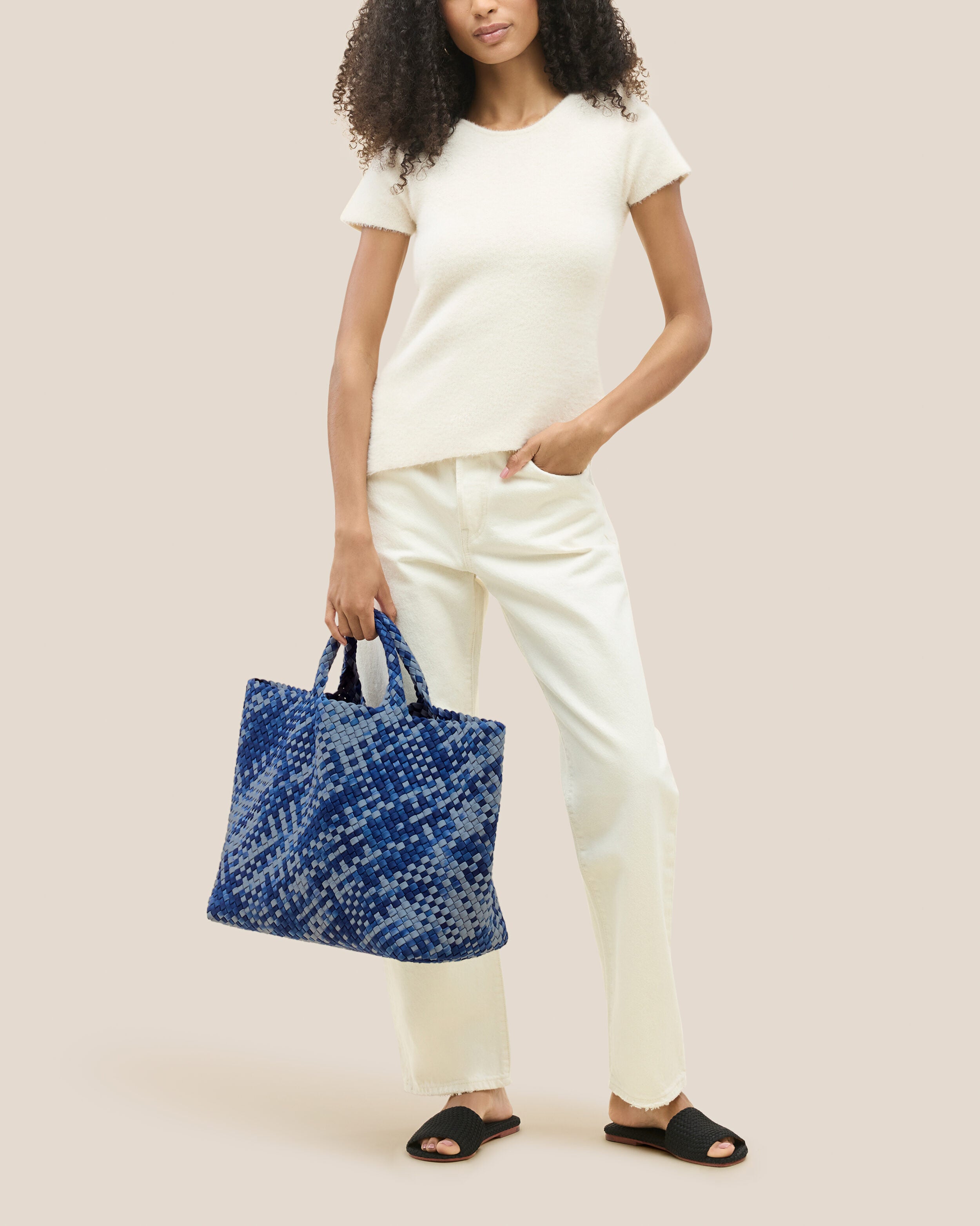 St. Barths Tote in Paros shown on model to illustrate scale and soft silhouette.
