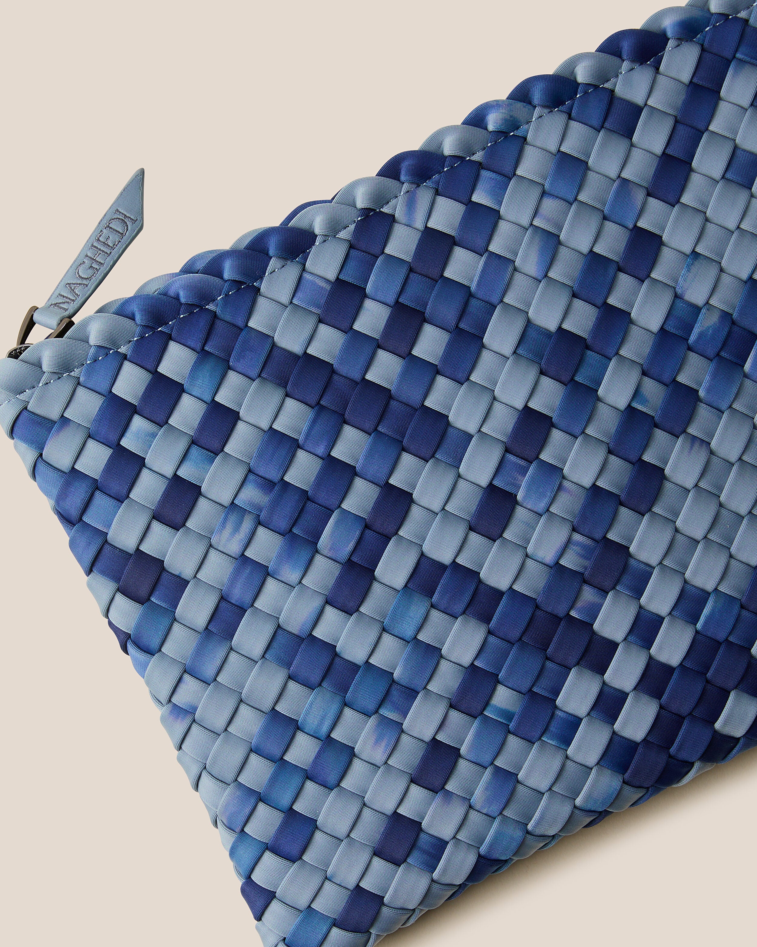 Close-up of included matching woven zippered pouch.