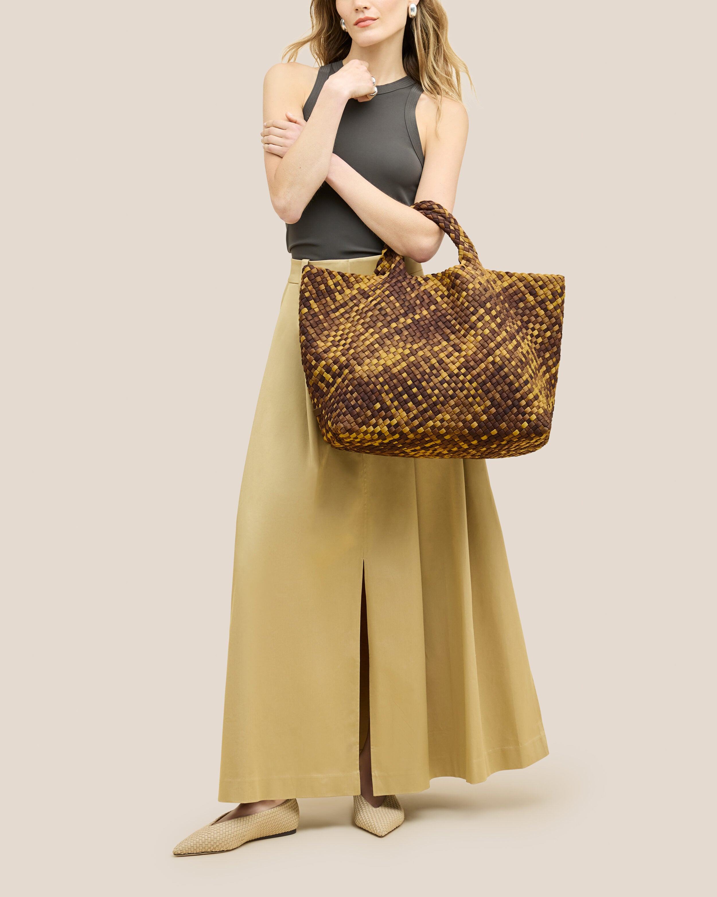 St. Barths Tote in Tortoiseshell shown on model to illustrate scale and soft silhouette.