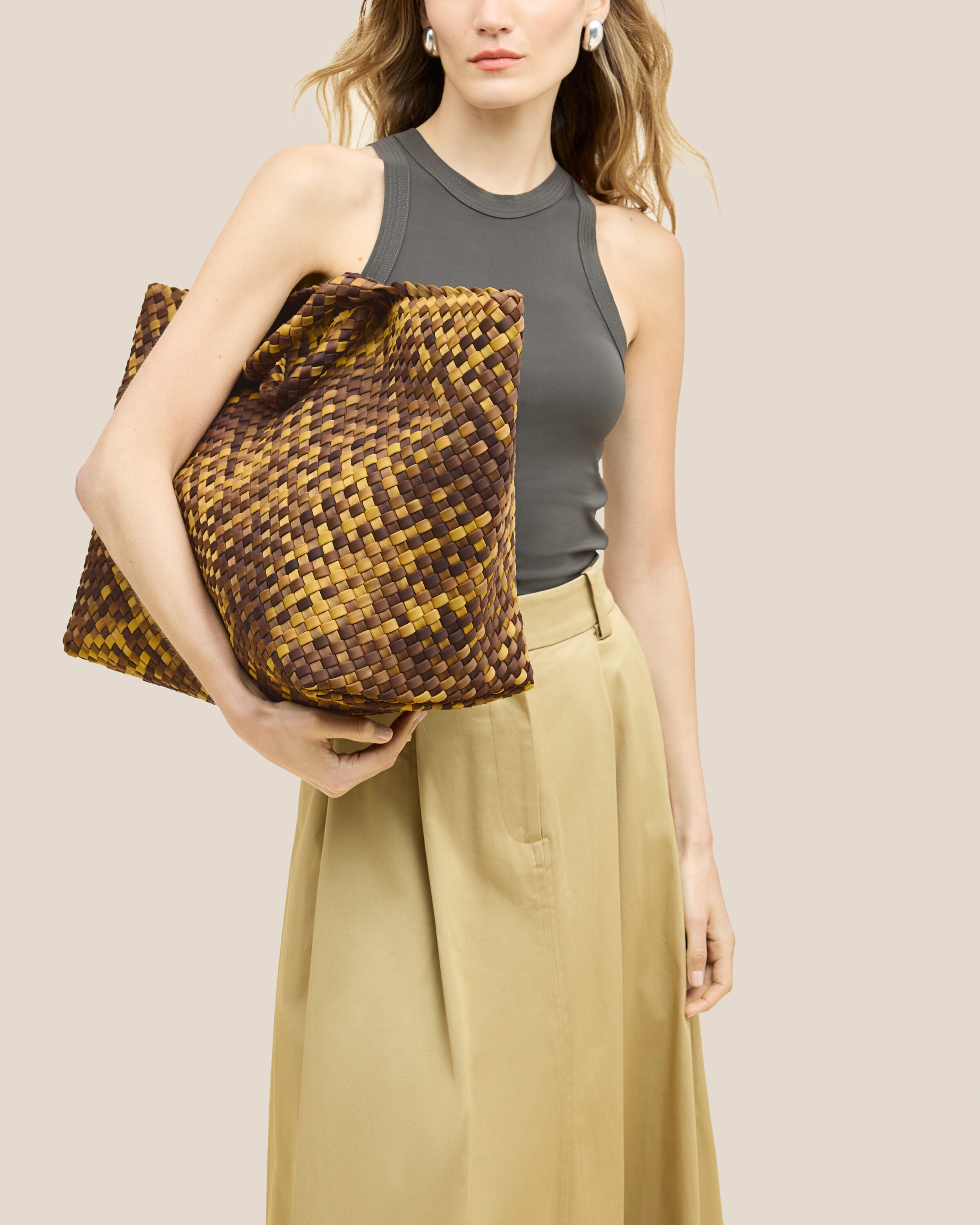 St. Barths Tote in Tortoiseshell shown on model to illustrate scale and soft silhouette.