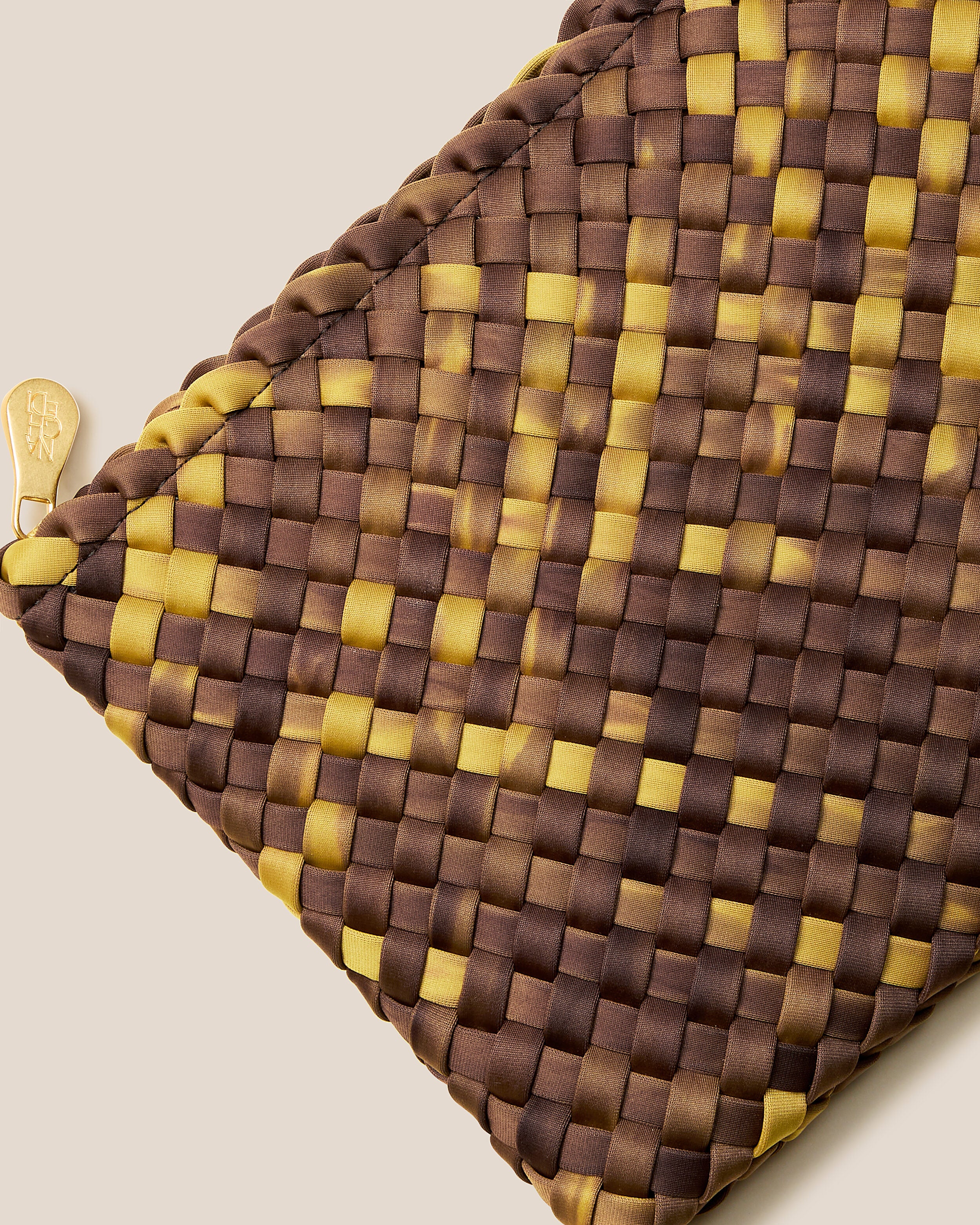 Close-up of included matching woven zippered pouch.